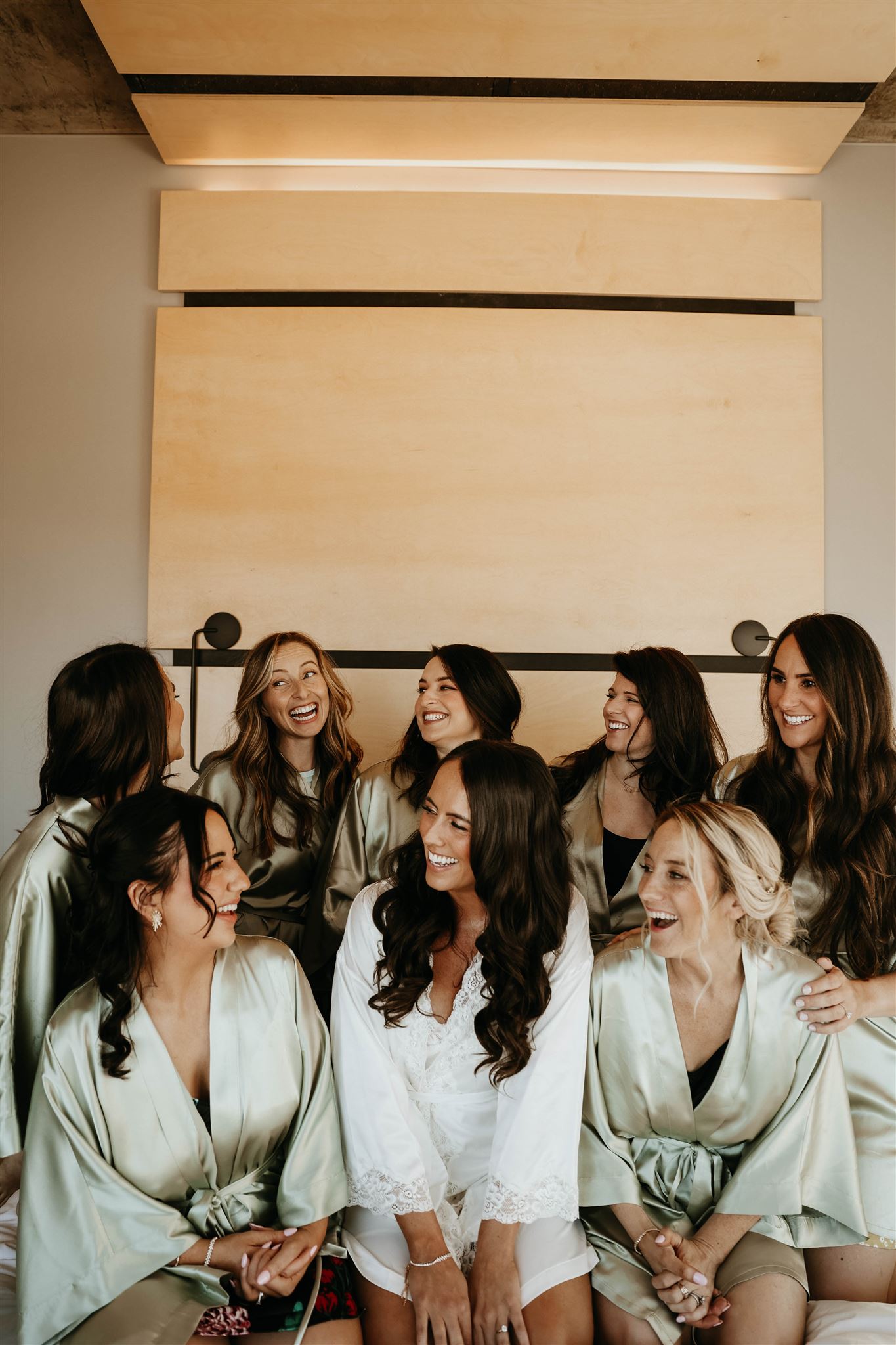 bride and bridesmaids in getting ready outfits 