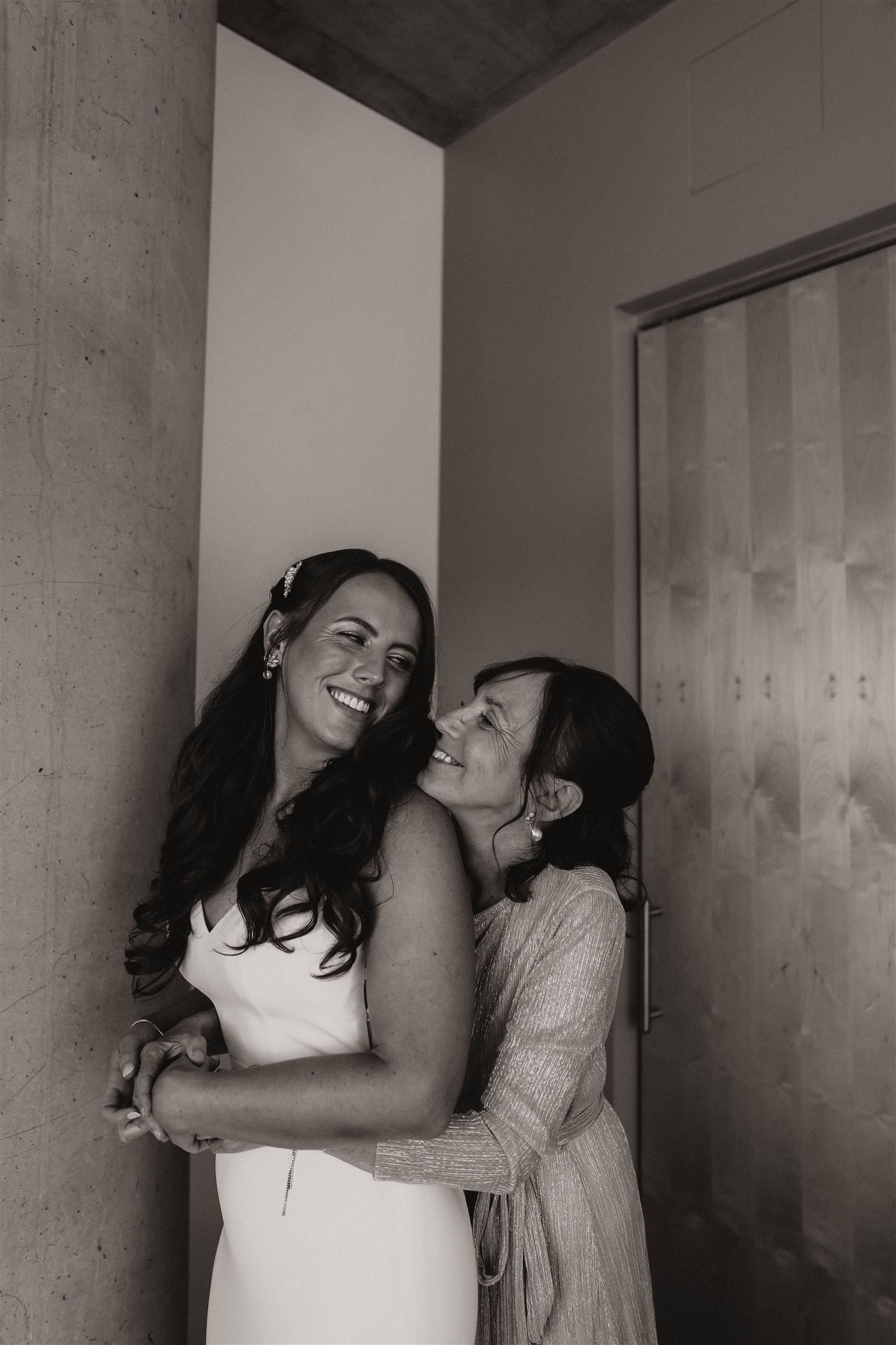 mother and bride hugging at fall wedding in colorado 