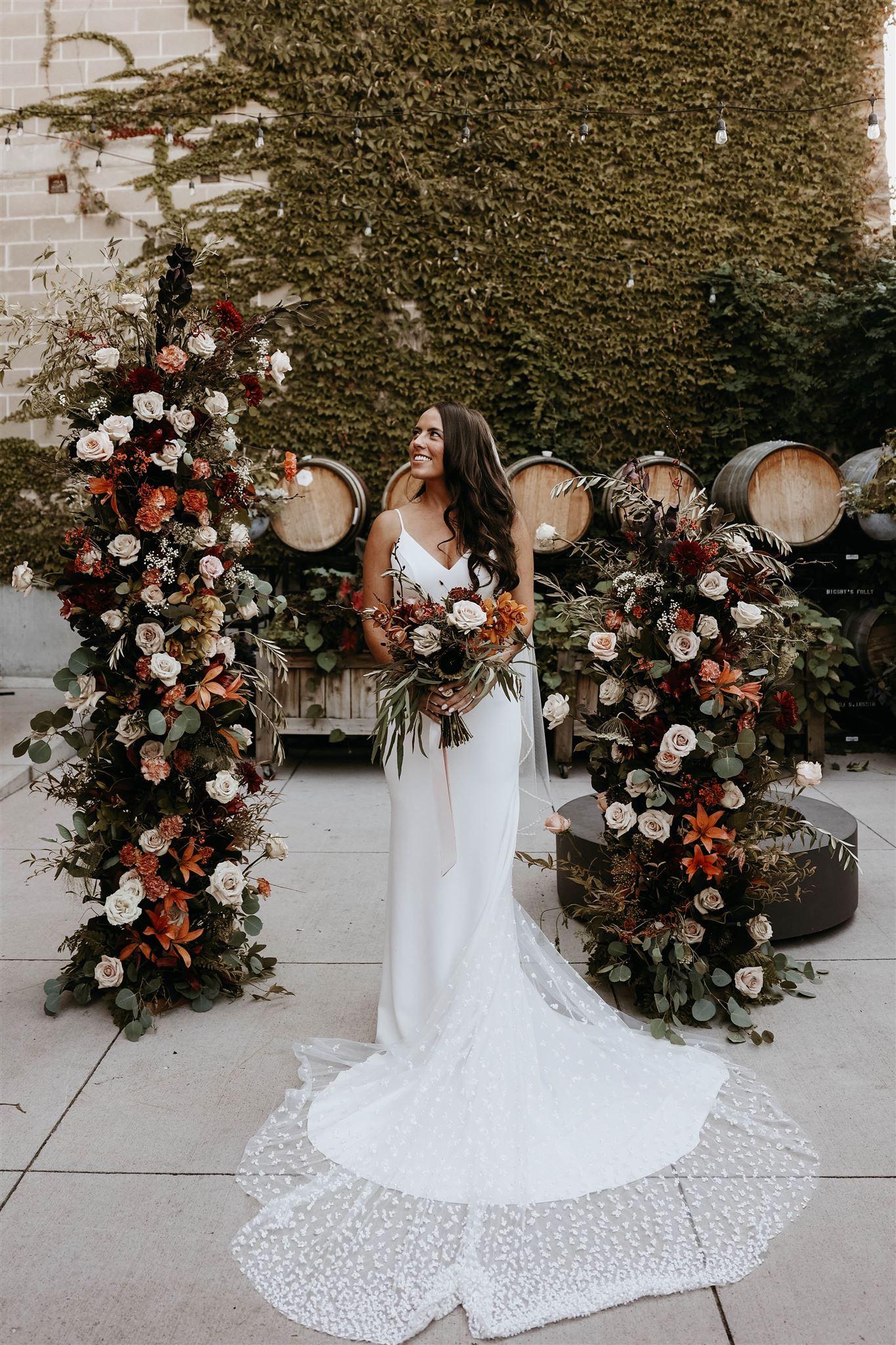 bridal portrait in front of winery wedding altar