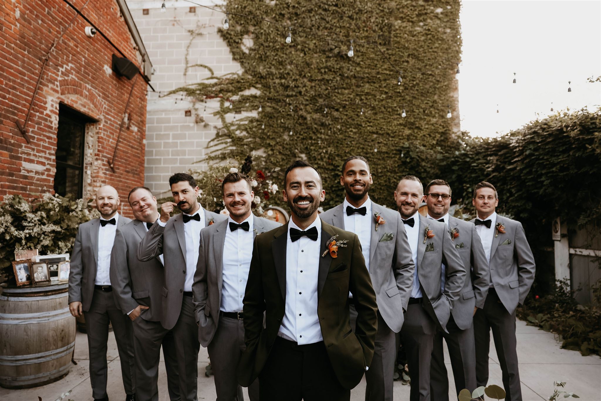 groom and groomsmen smiling 