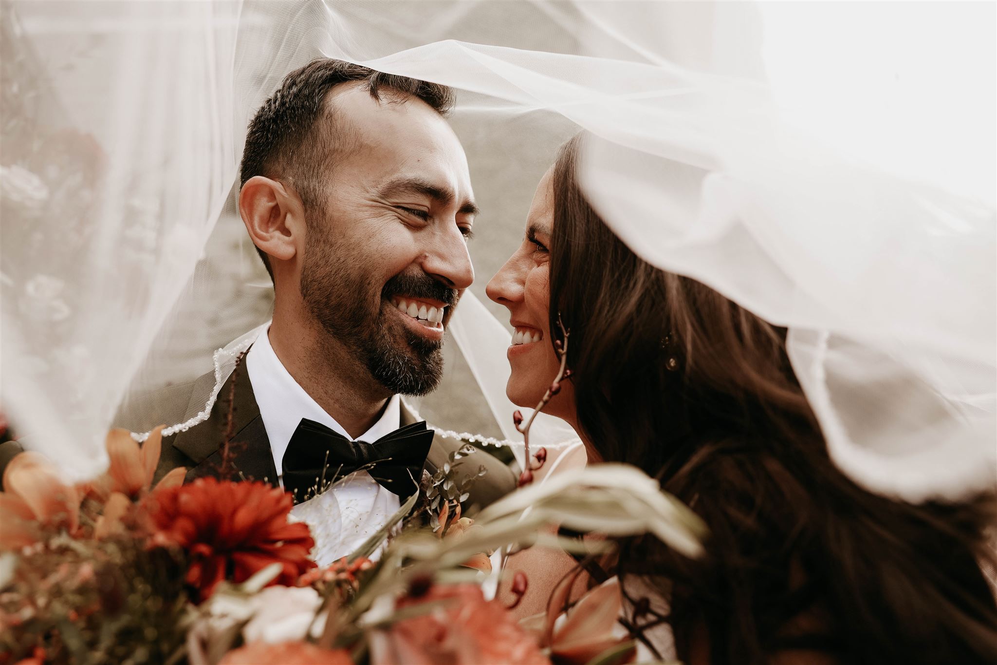 bride and groom veil portrait at fall wedding in colorado 