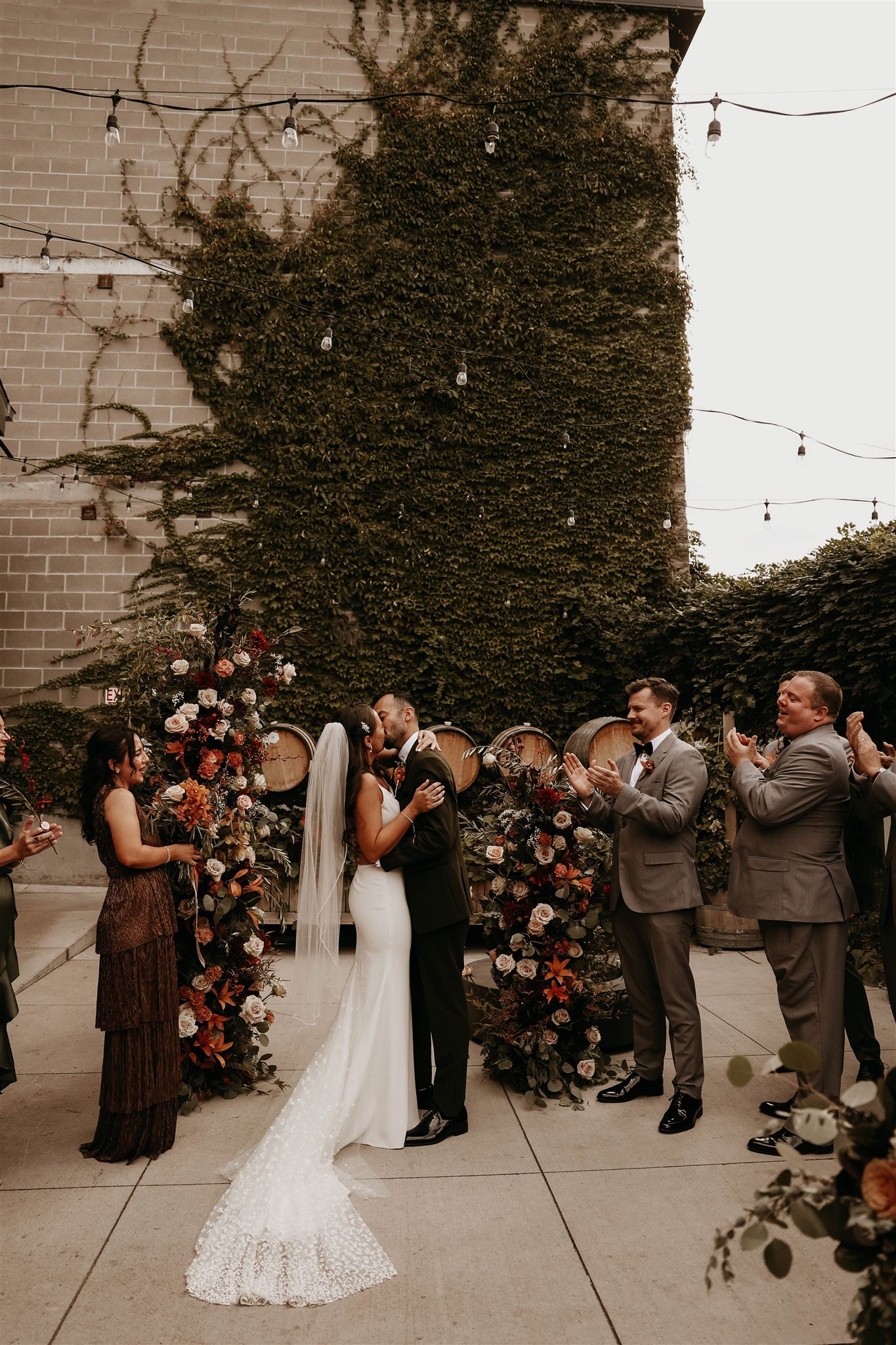 bride and groom kissing at the altar at fall wedding in colorado 