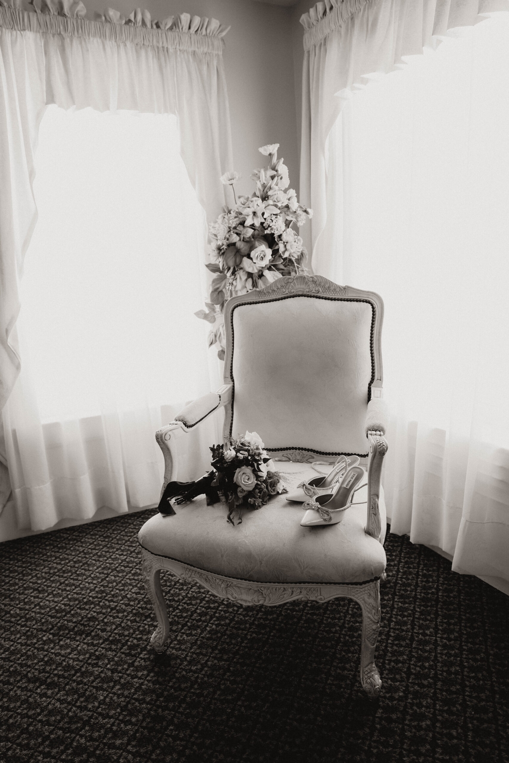 bride's shoes and bouquet on a chair 