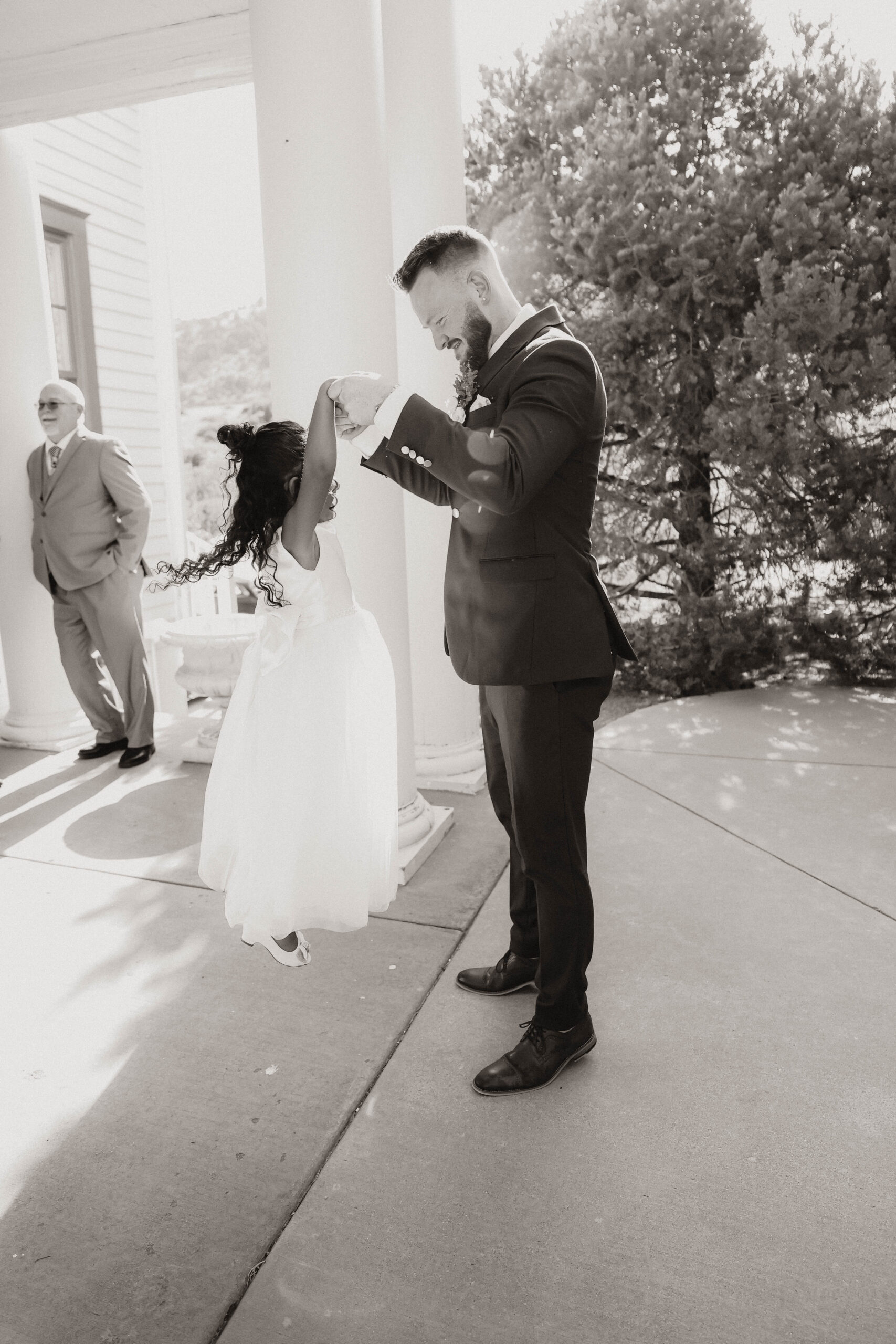 groom and a daughter playing 