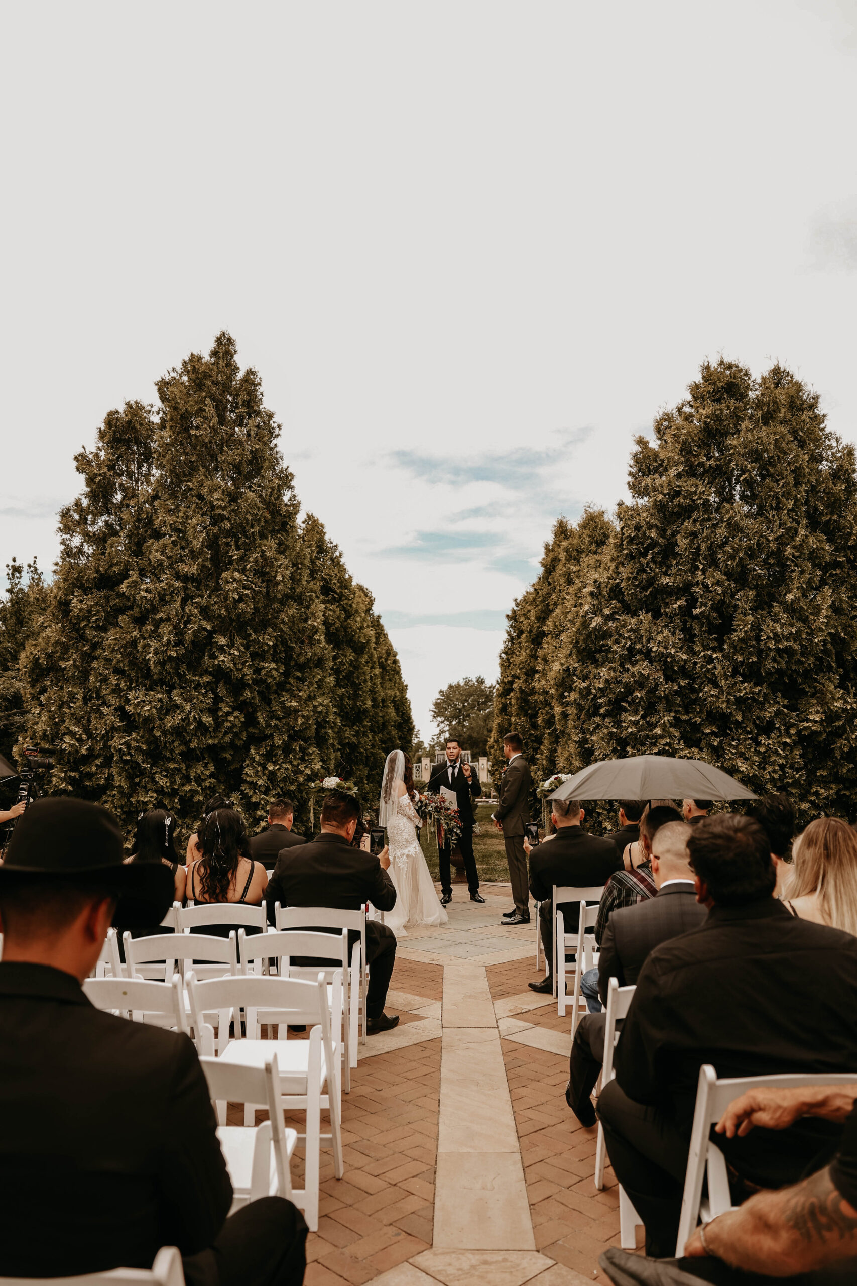 bride and groom at the altar at romantic denver botanic gardens