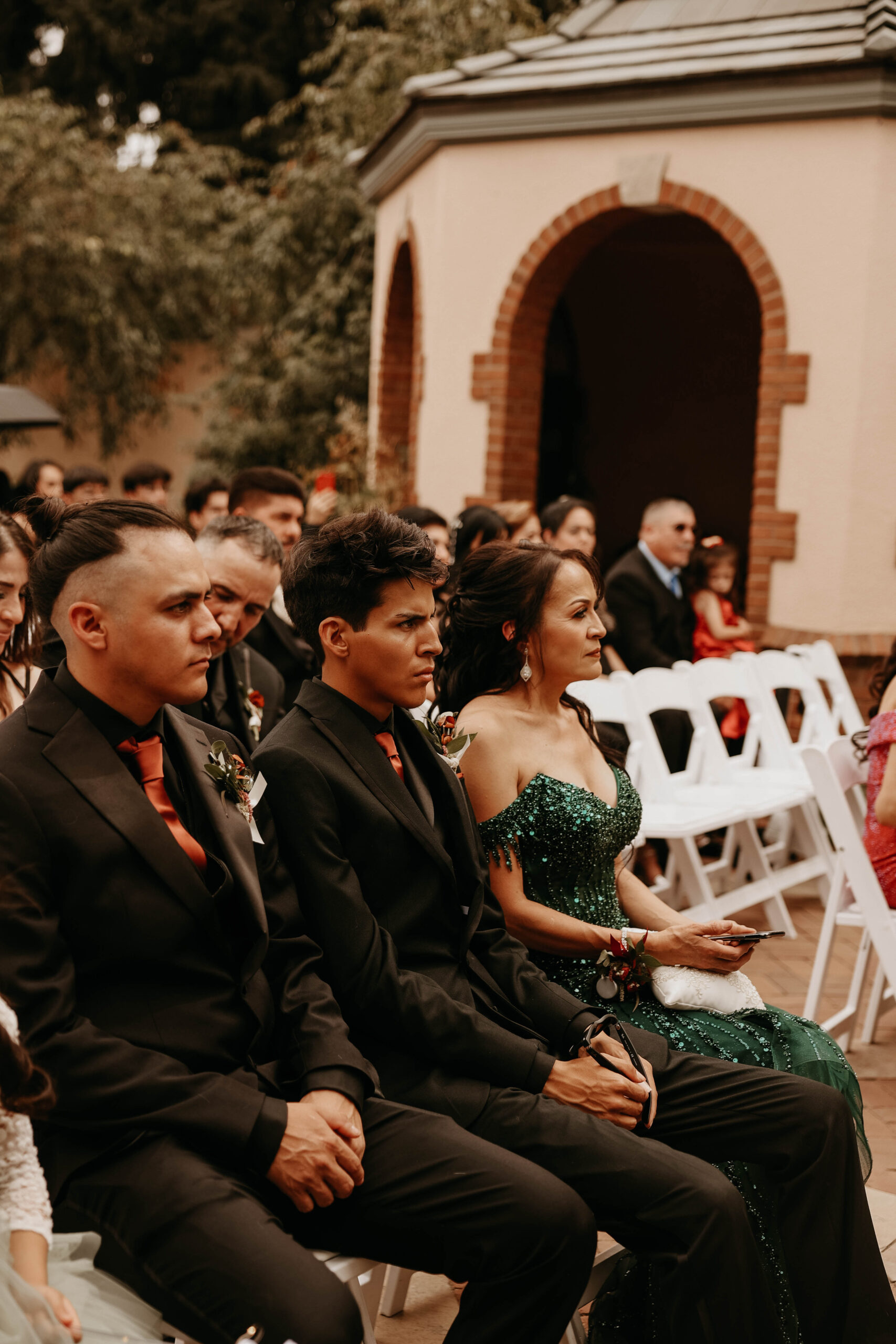 candid of wedding guests during the ceremony 