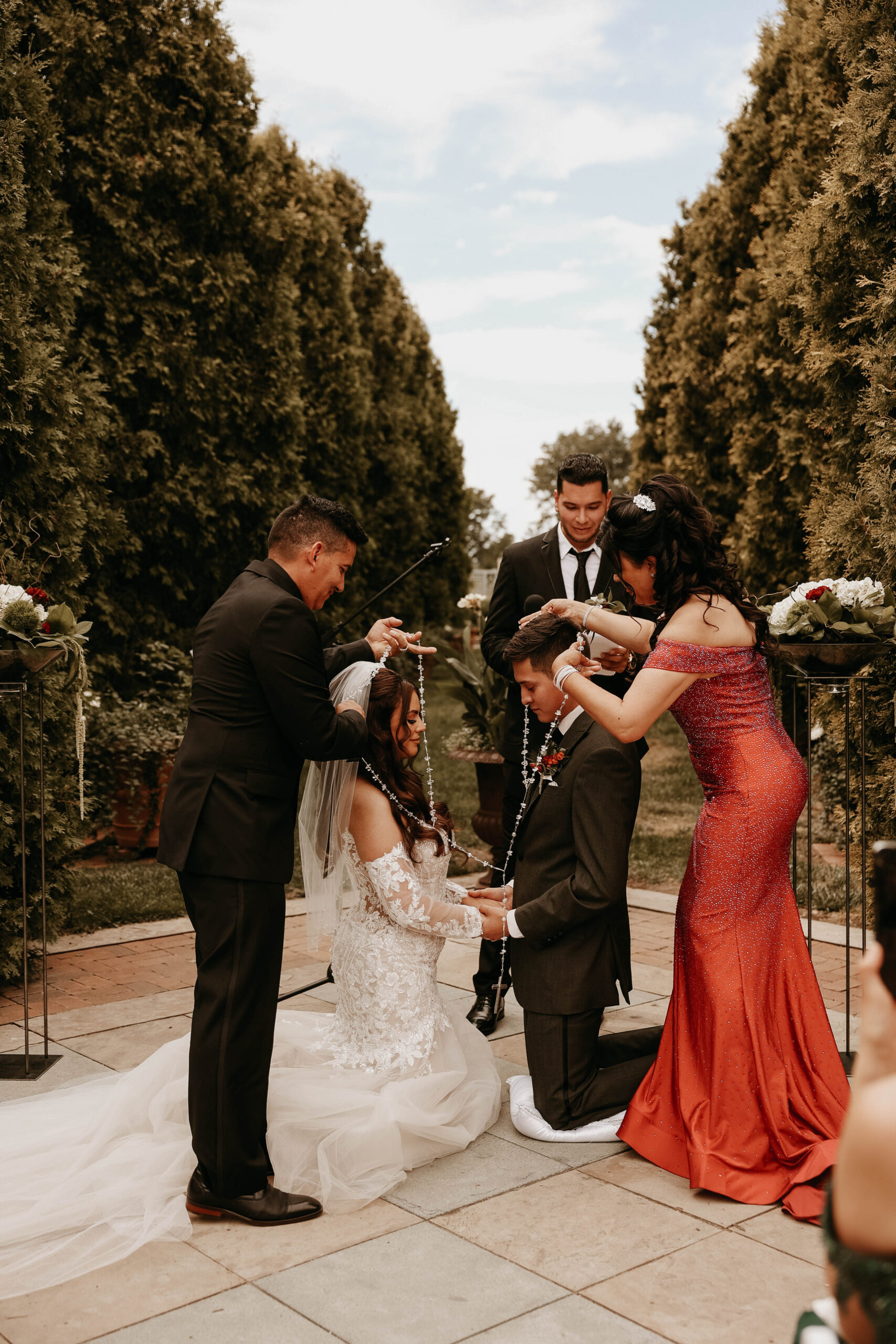 bride and groom during catholic ceremony at romantic denver botanic gardens