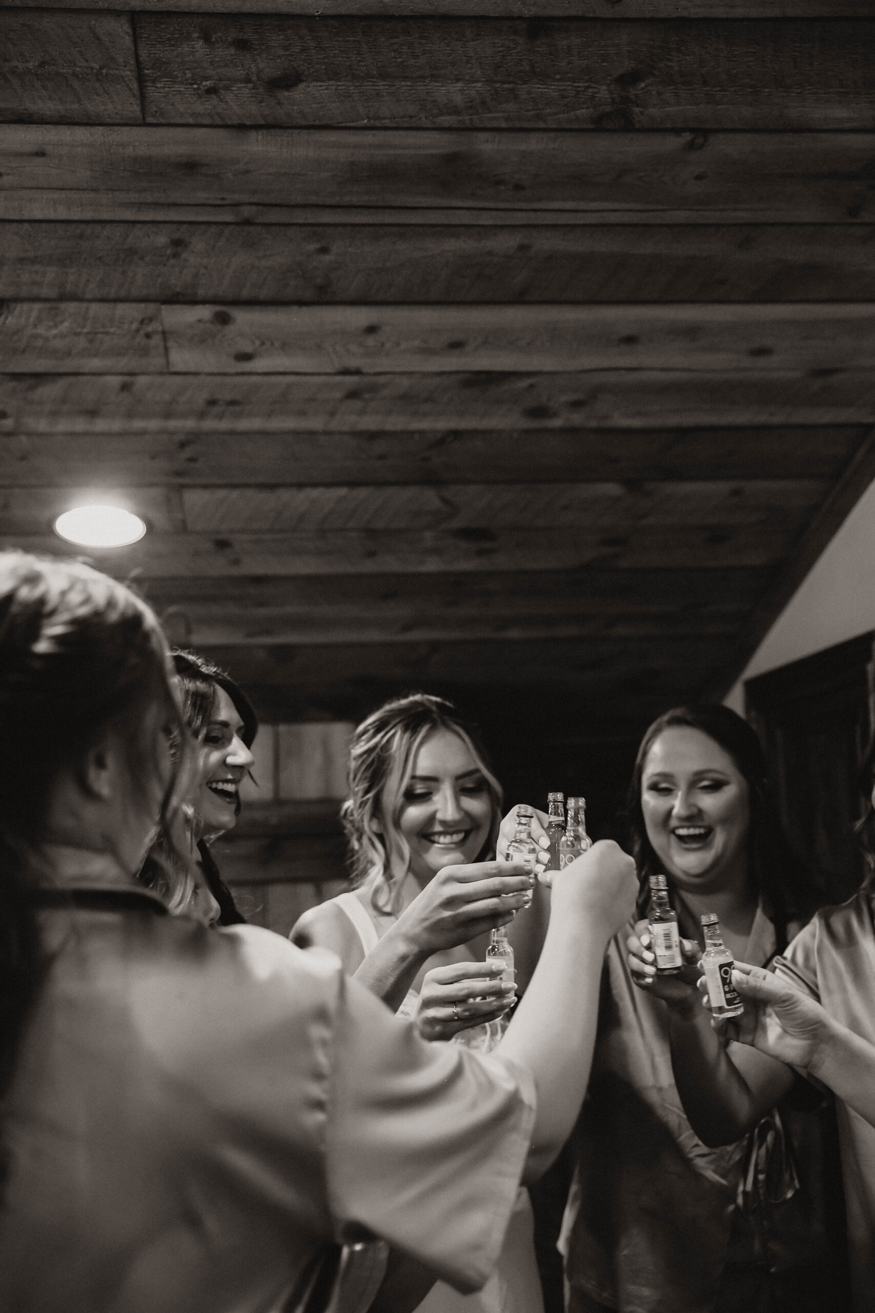 bride cheersing with bridesmaids 