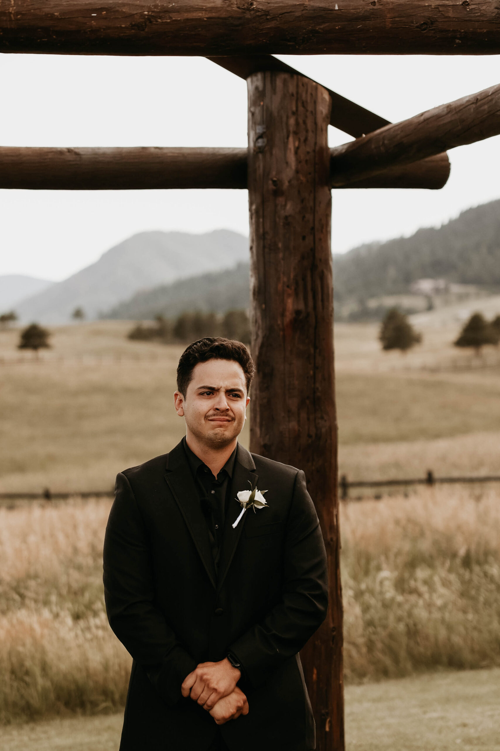 grooms reaction to bride walking down the aisle at Spruce Mountain Ranch Wedding 