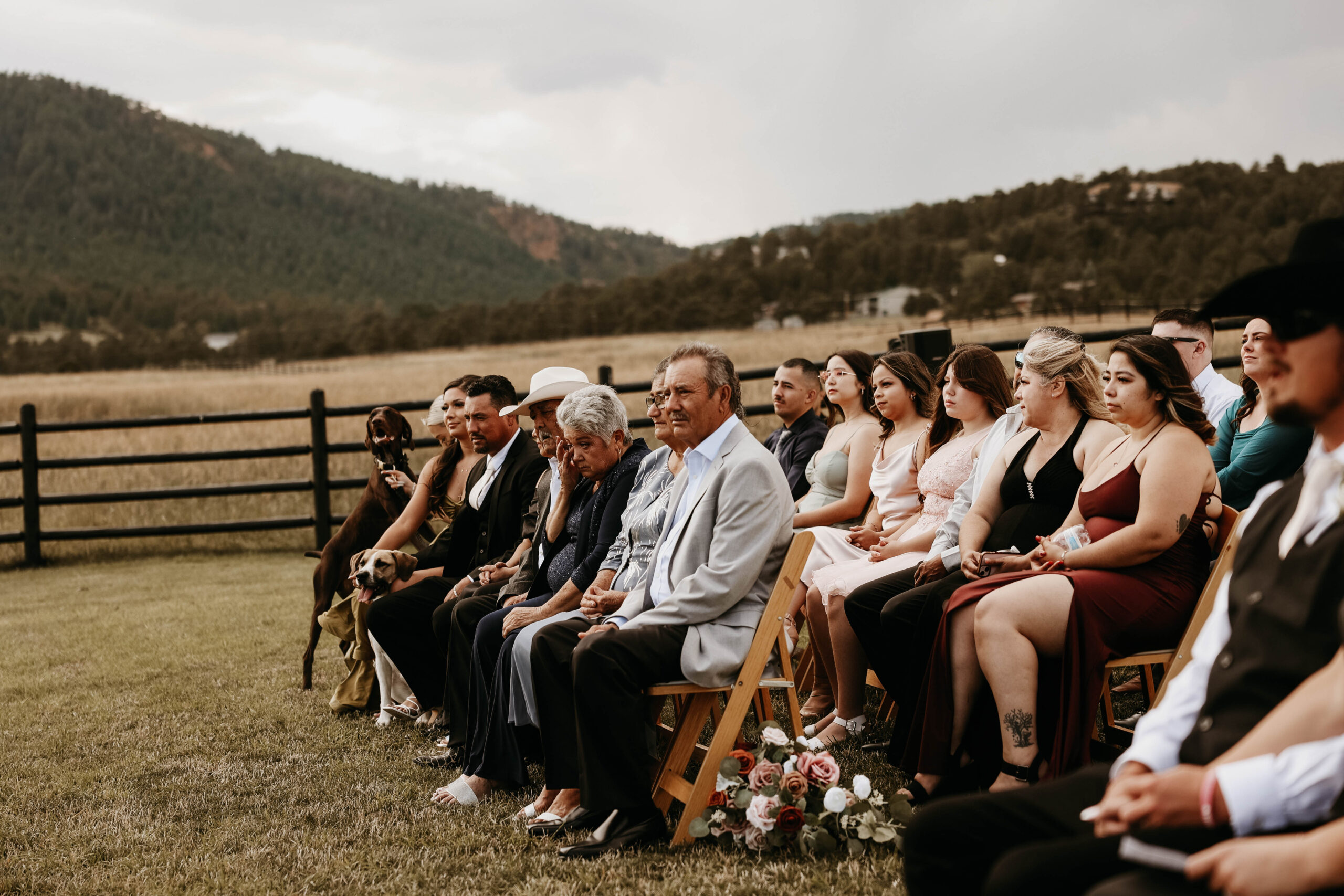 wedding guests during the ceremony of the  Spruce Mountain Ranch Wedding 