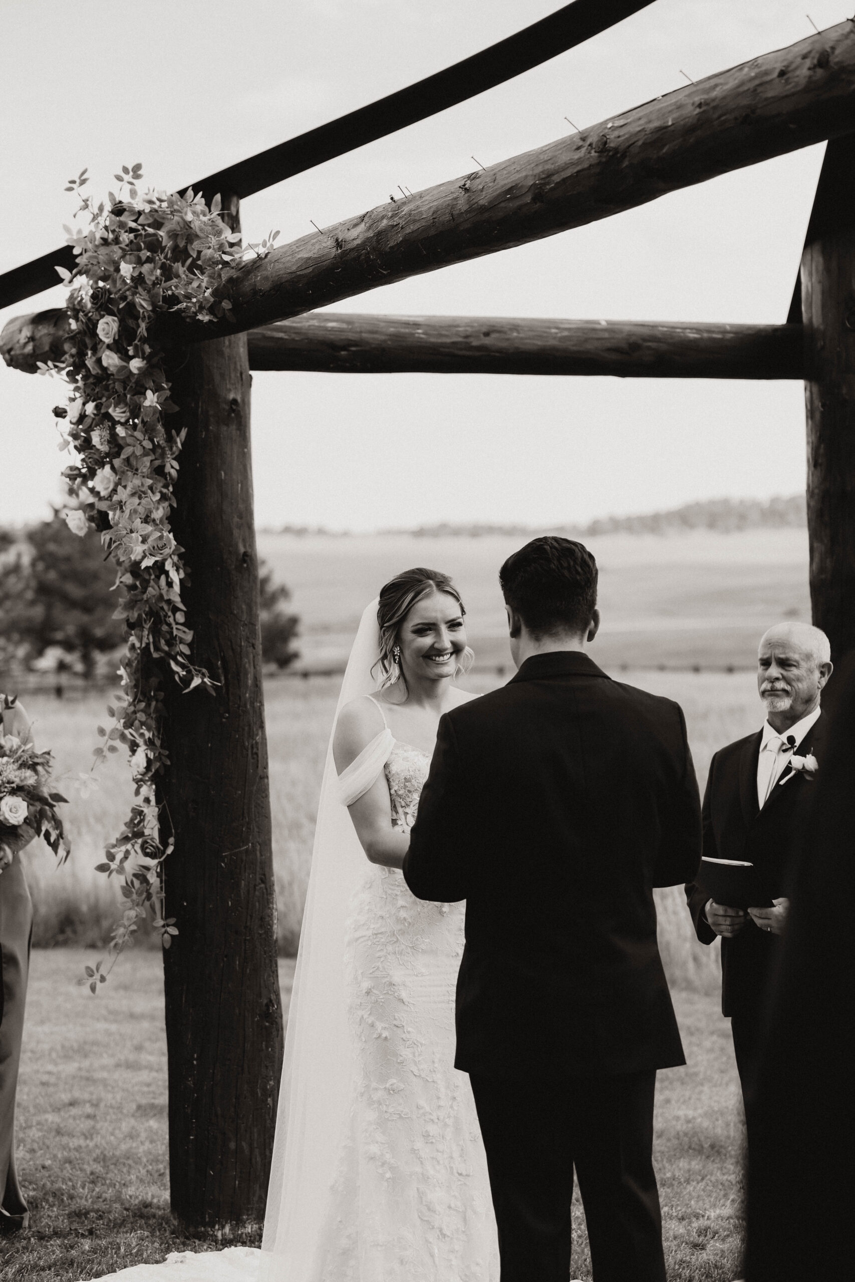 bride smiling during the  Spruce Mountain Ranch Wedding ceremony 