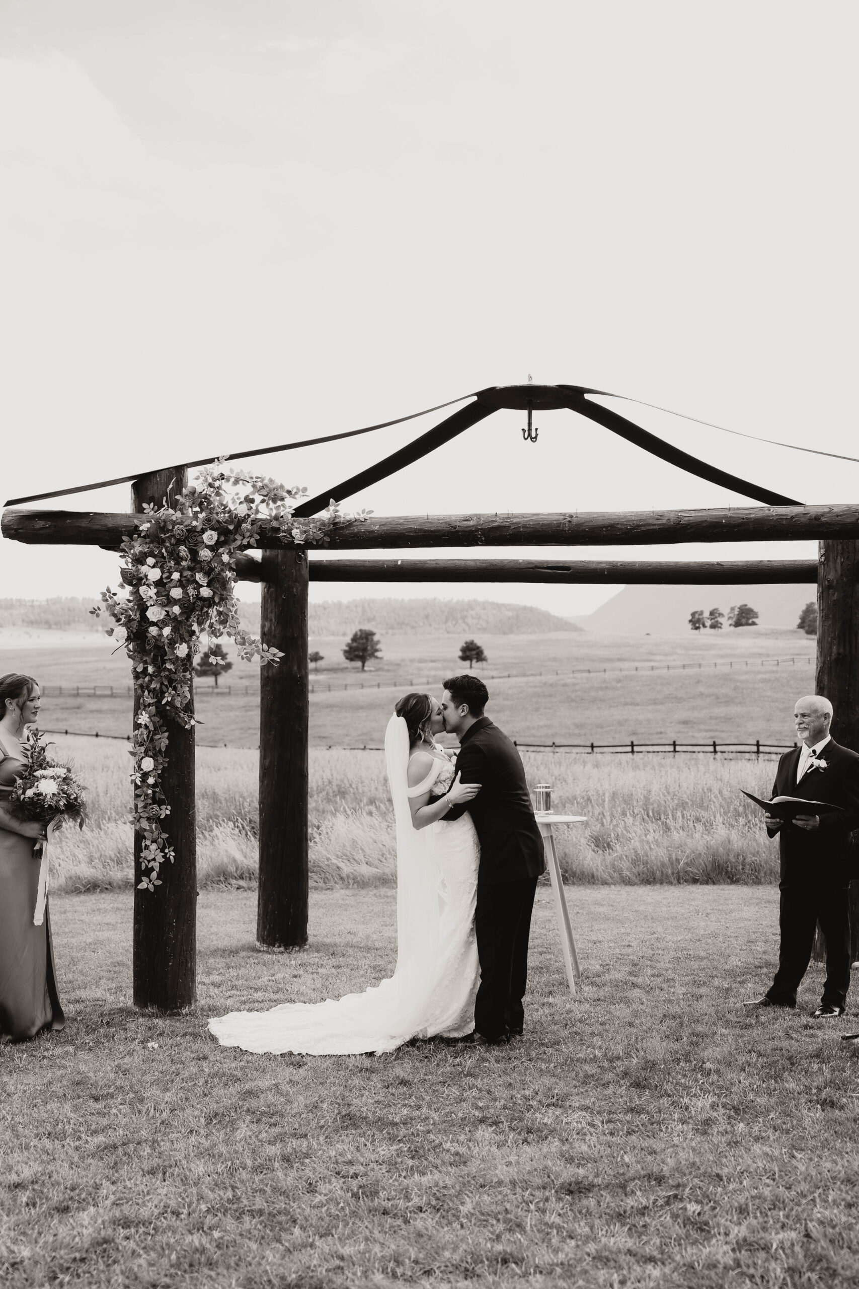 bride and groom kissing at  Spruce Mountain Ranch Wedding ceremony 