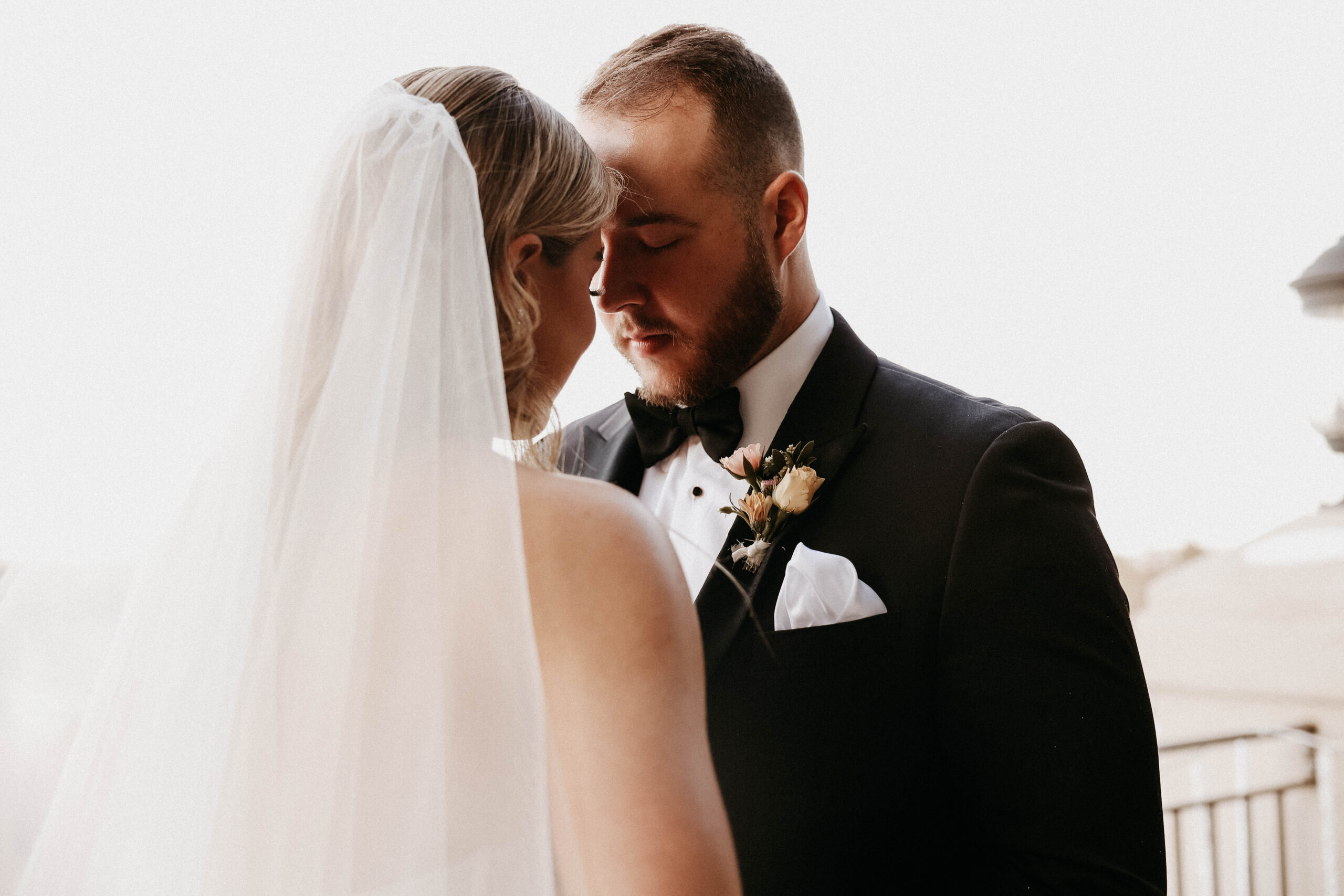 bridal couple with their foreheads together during their Colorado micro wedding ceremony 