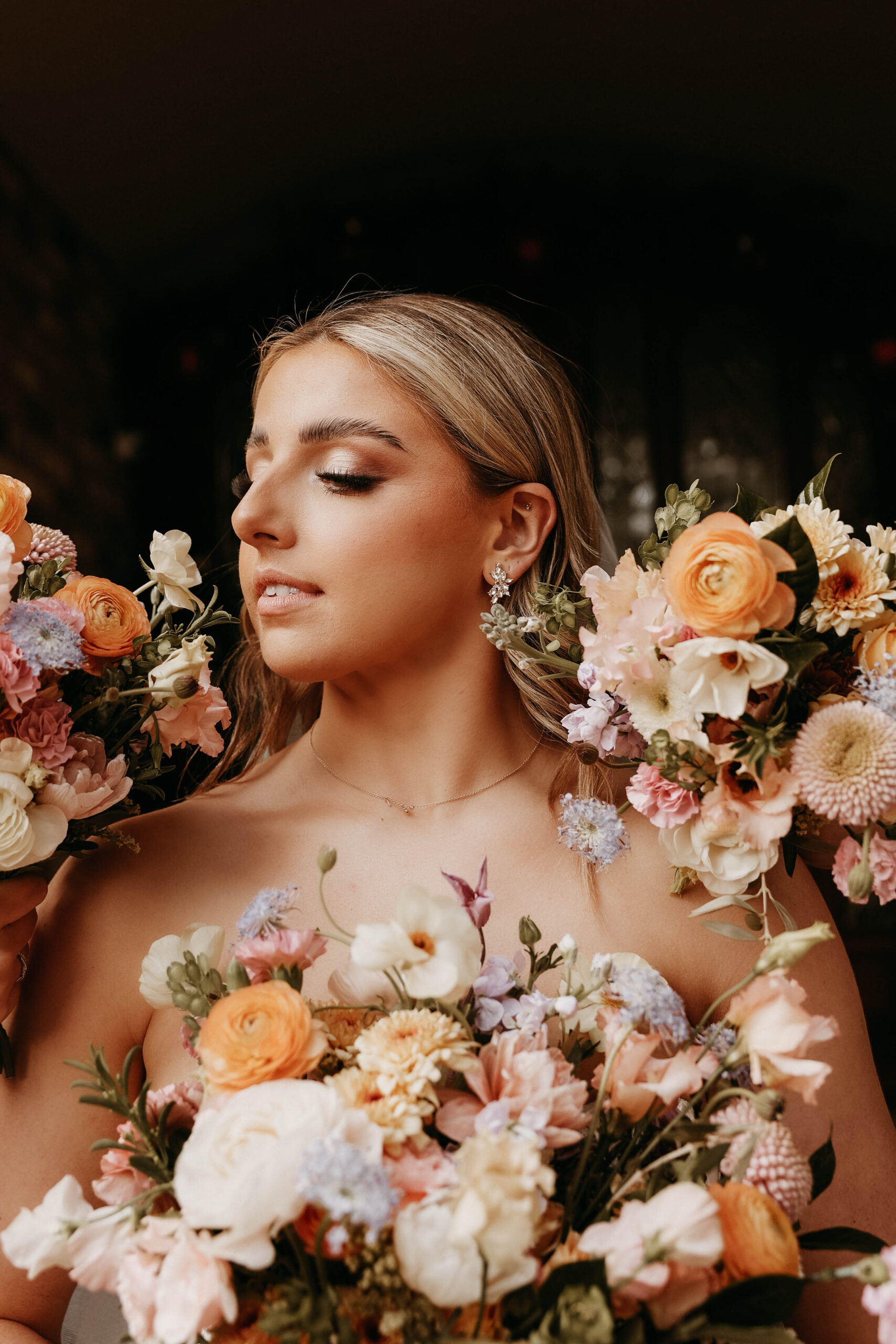 bridal portrait with flowers around her face 