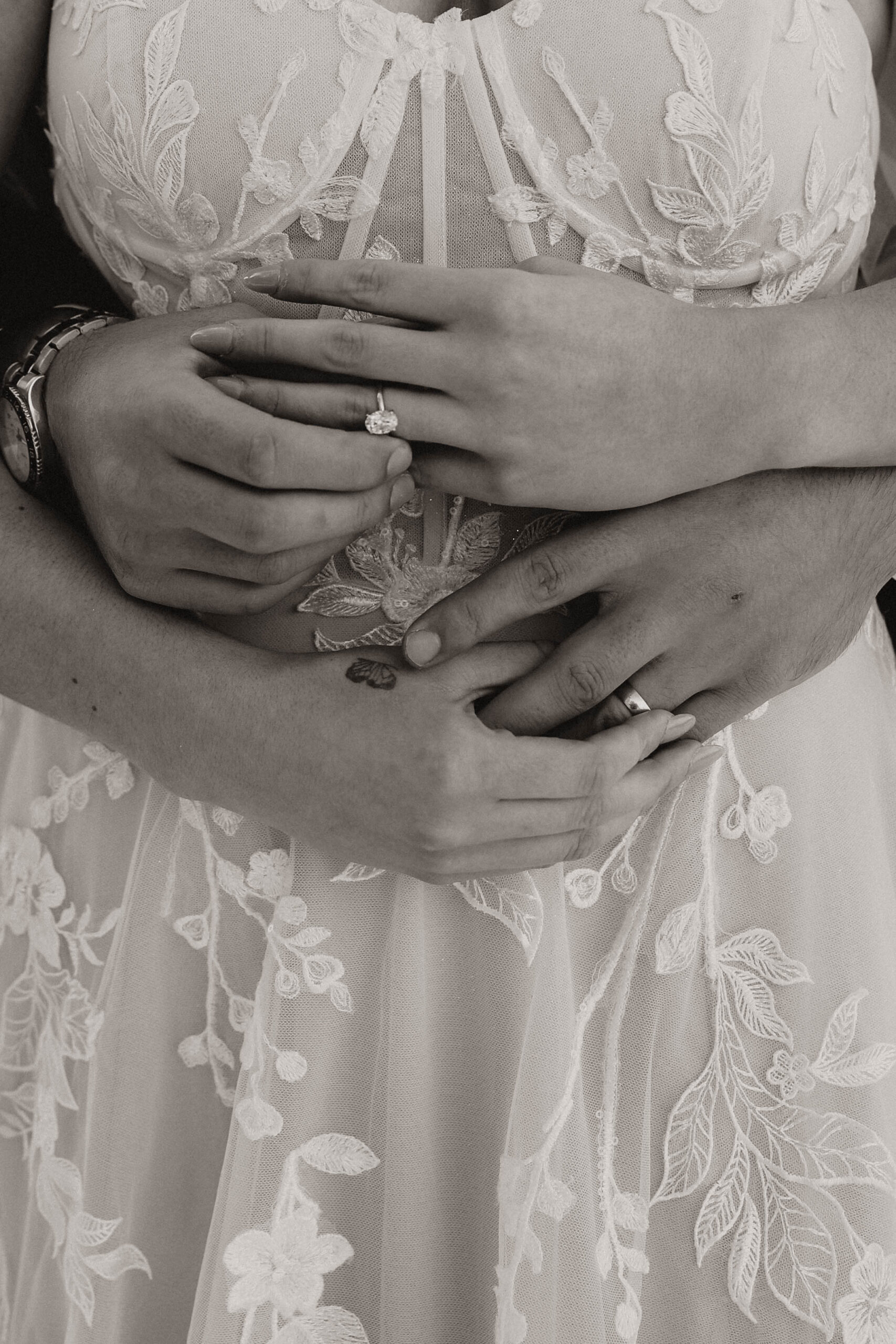 closeup of bridal couple holding hands at Colorado micro wedding 