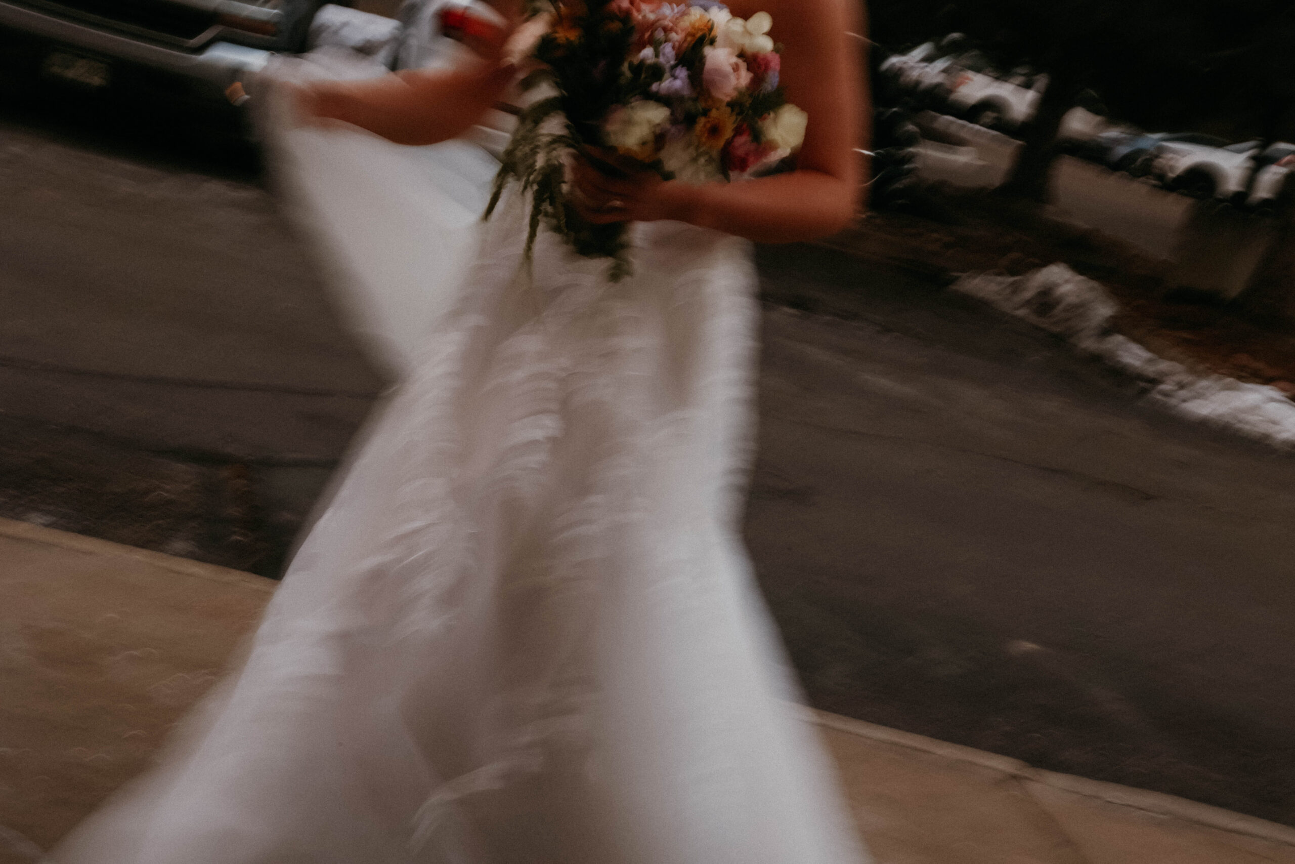 blurry photo of bride walking 