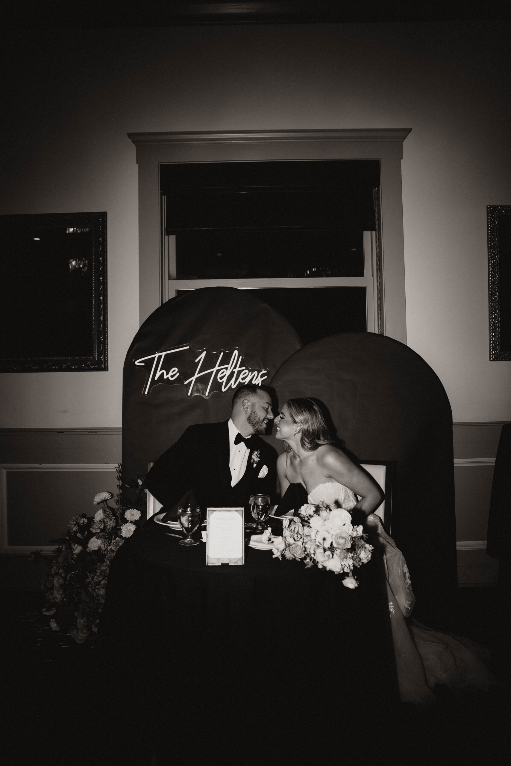 bridal couple sitting at their Colorado micro wedding reception table 