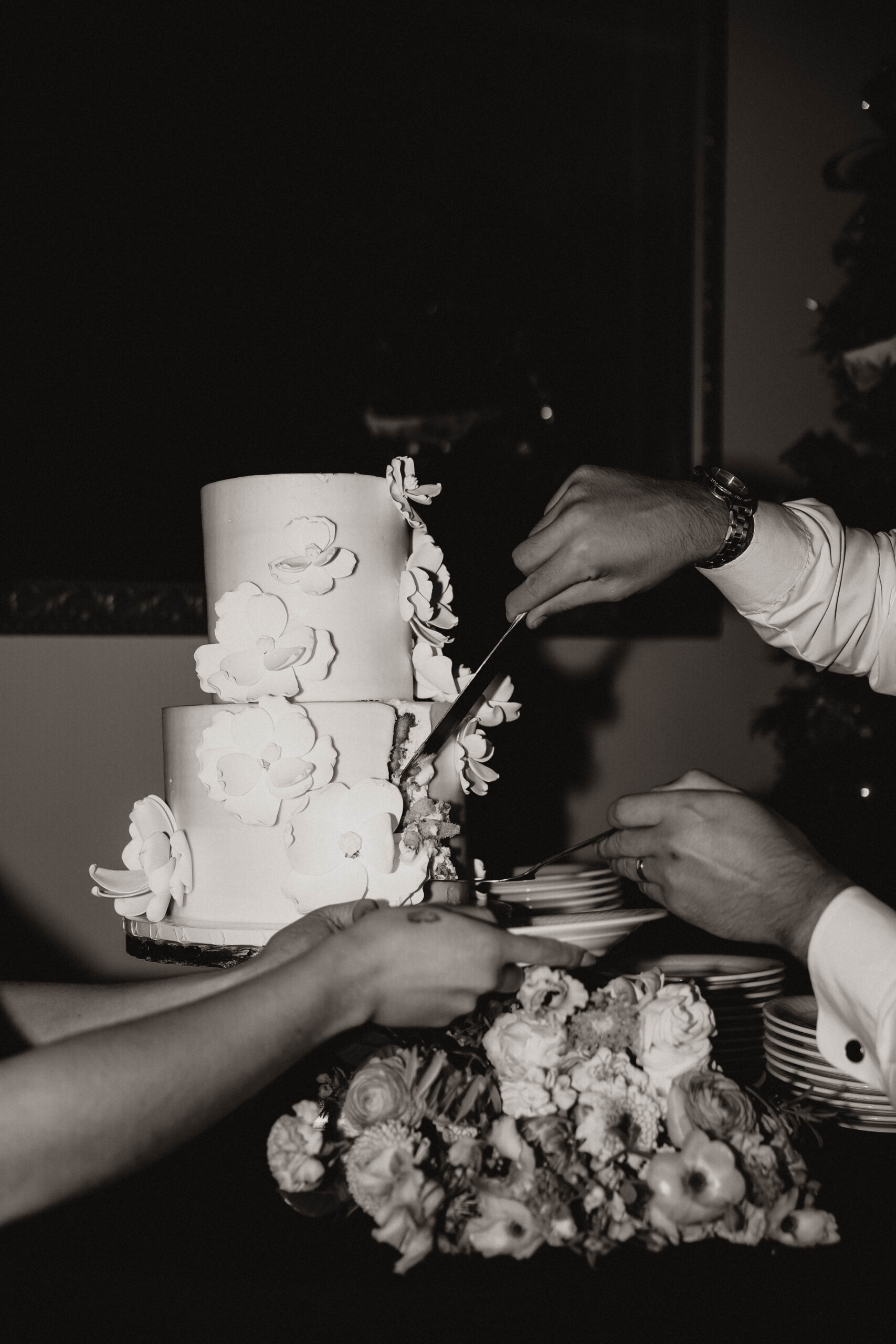 detail shot of groom cutting their cake 