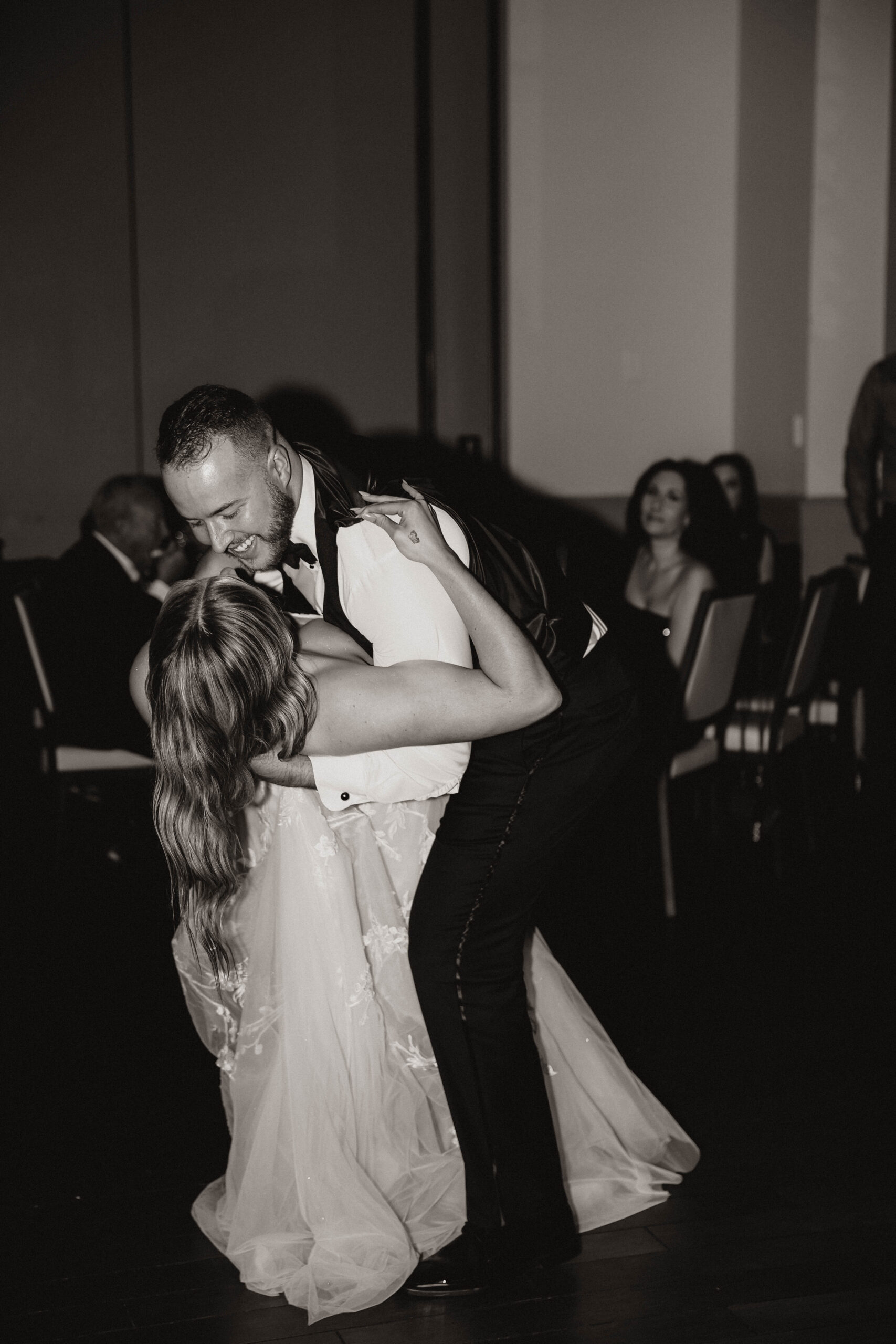 groom dipping bride during their first dance 