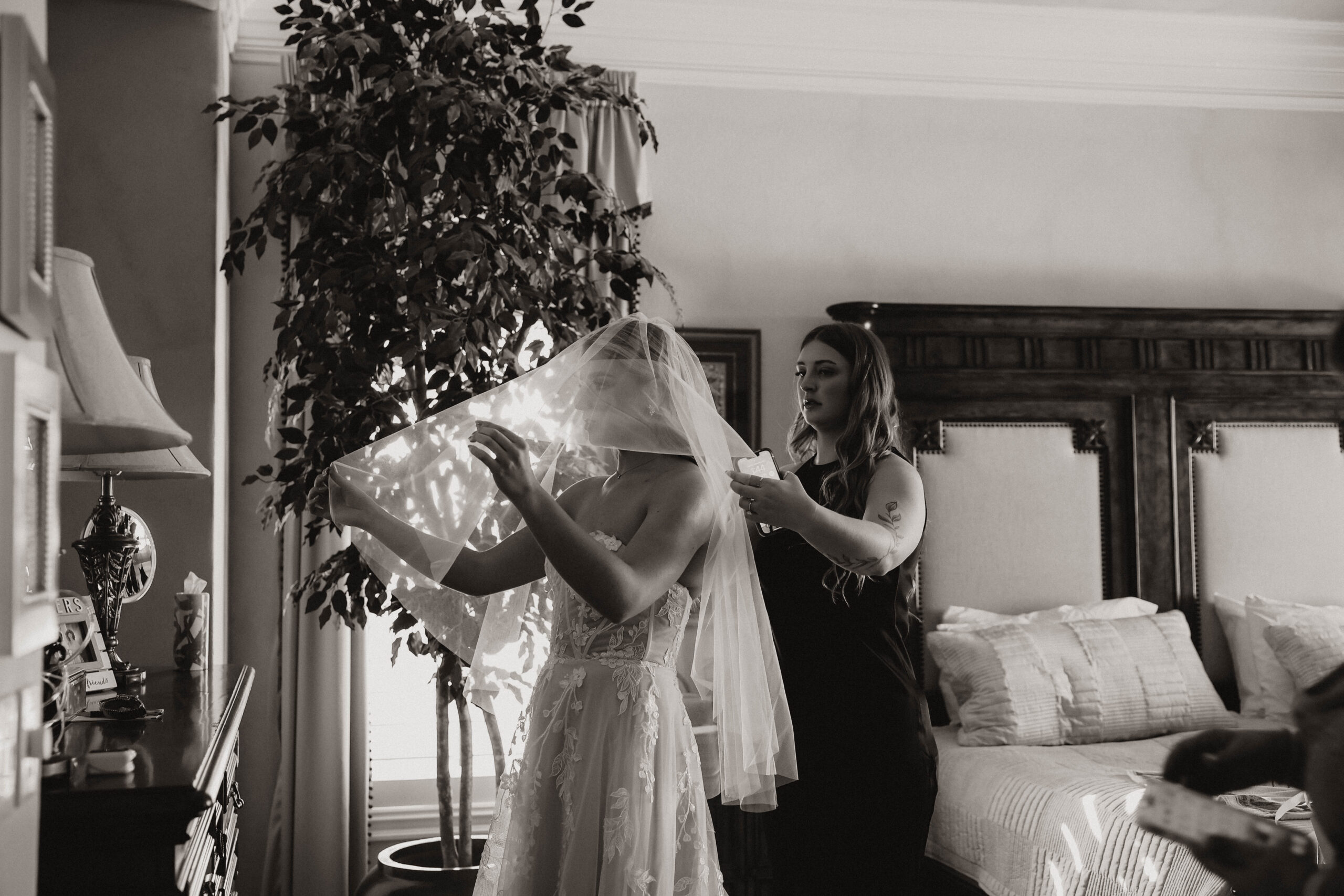 bride getting help with her veil before Colorado micro wedding 
