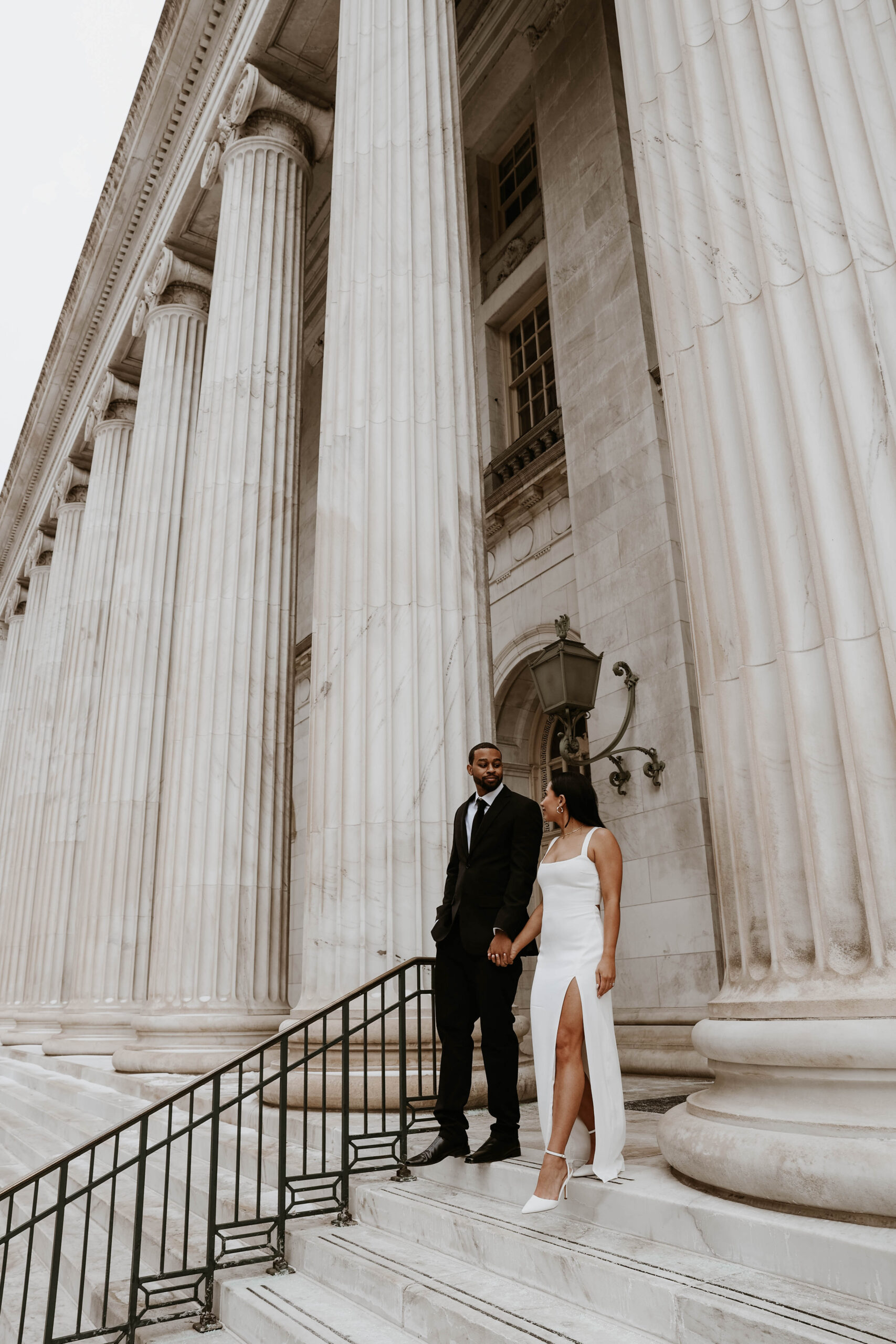 newly engaged couple during their unique engagement shoot at the courthouse 