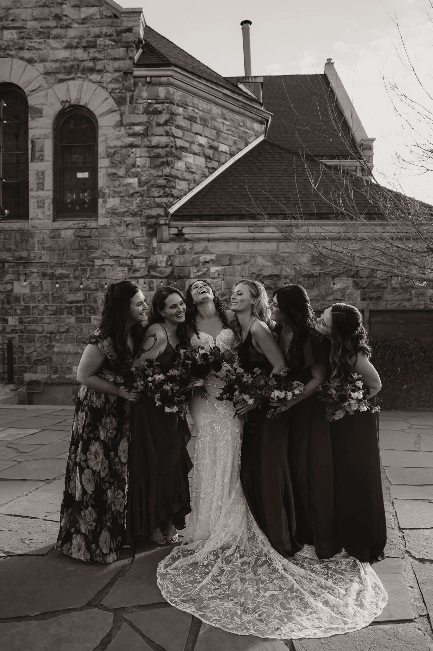 meaningful wedding moments of bride laughing with her bridesmaids 