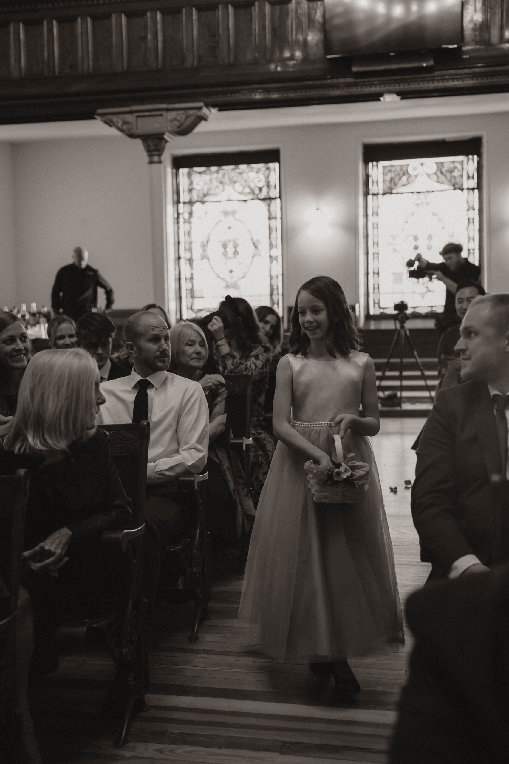 meaningful wedding of flower girl walking down the aisle