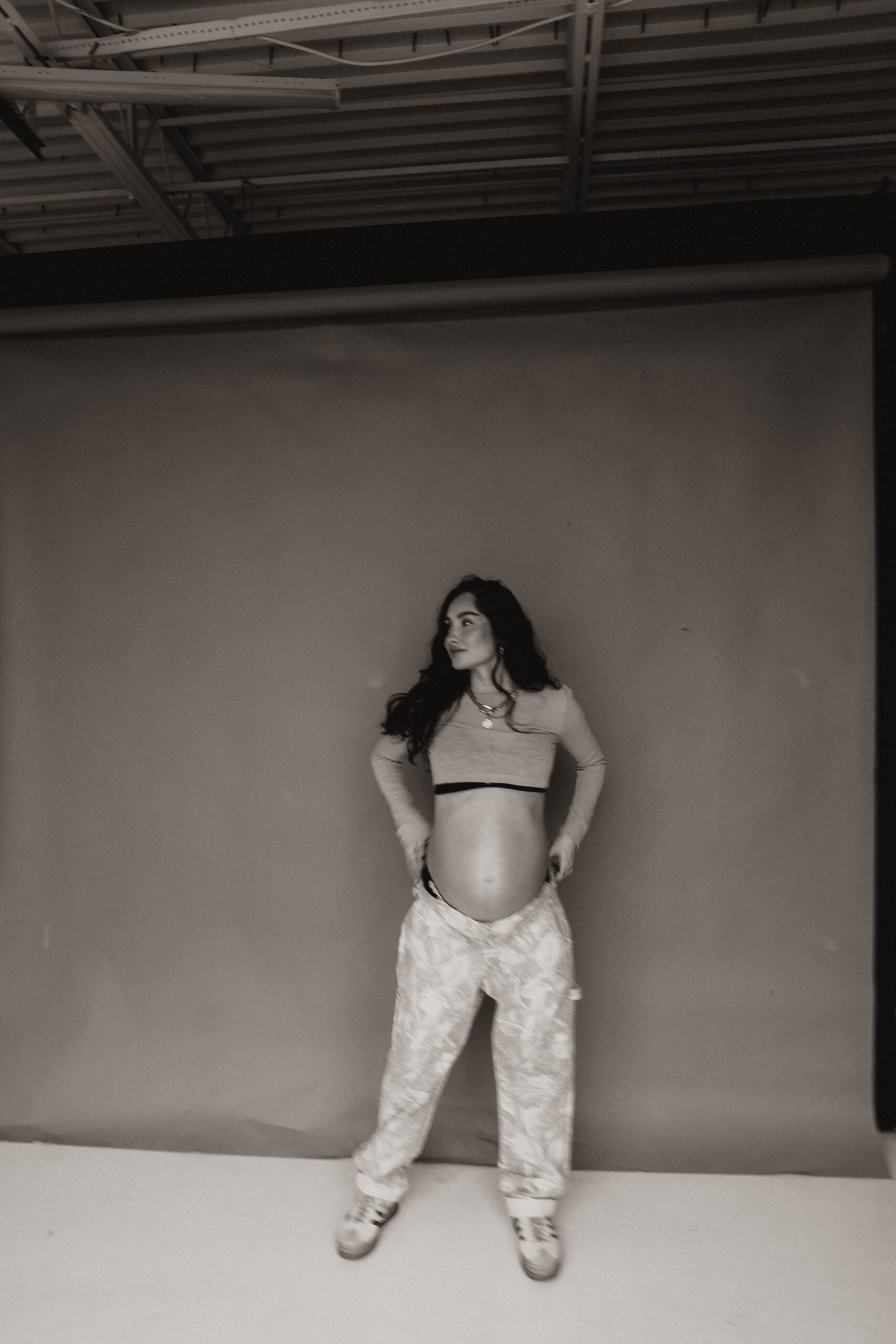 pregnant woman in studio denver maternity photoshoot