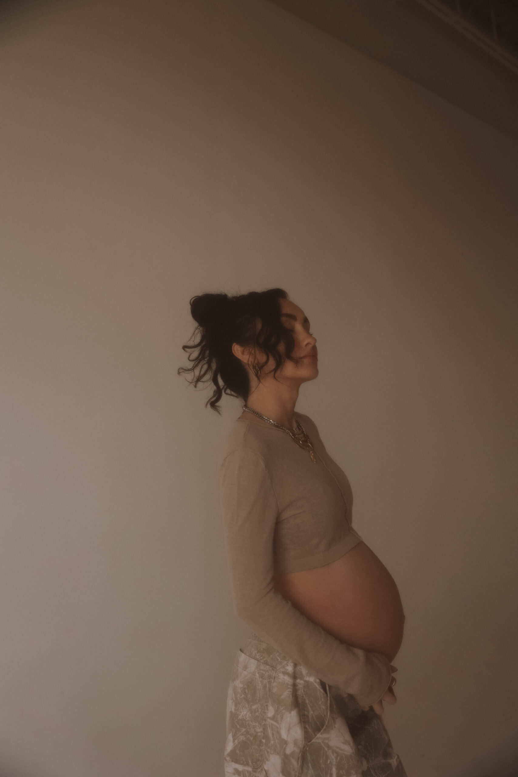 warm photo of a pregnant woman during a maternity session