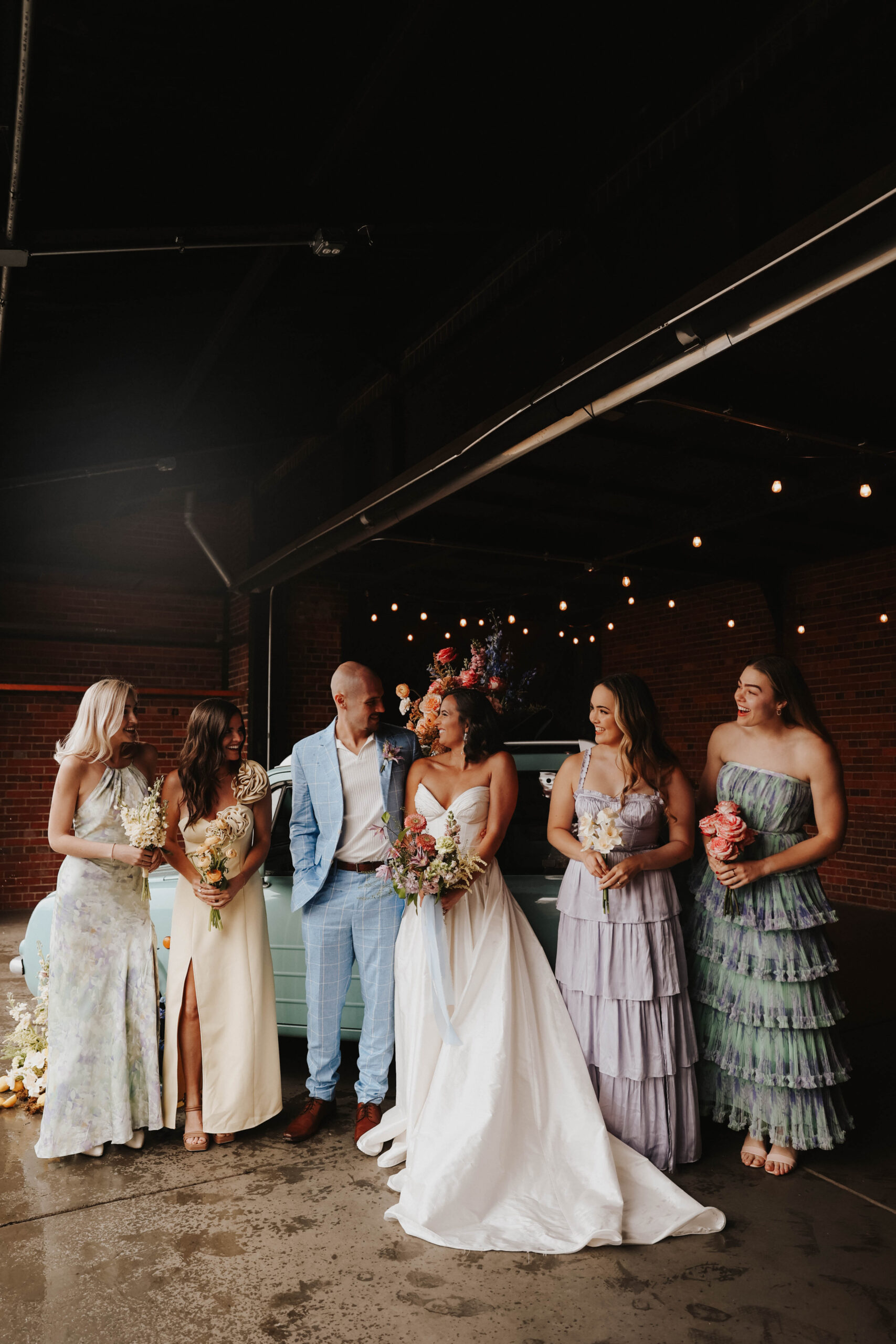 bride and groom and bridesmaids portrait during a colorful spring wedding 