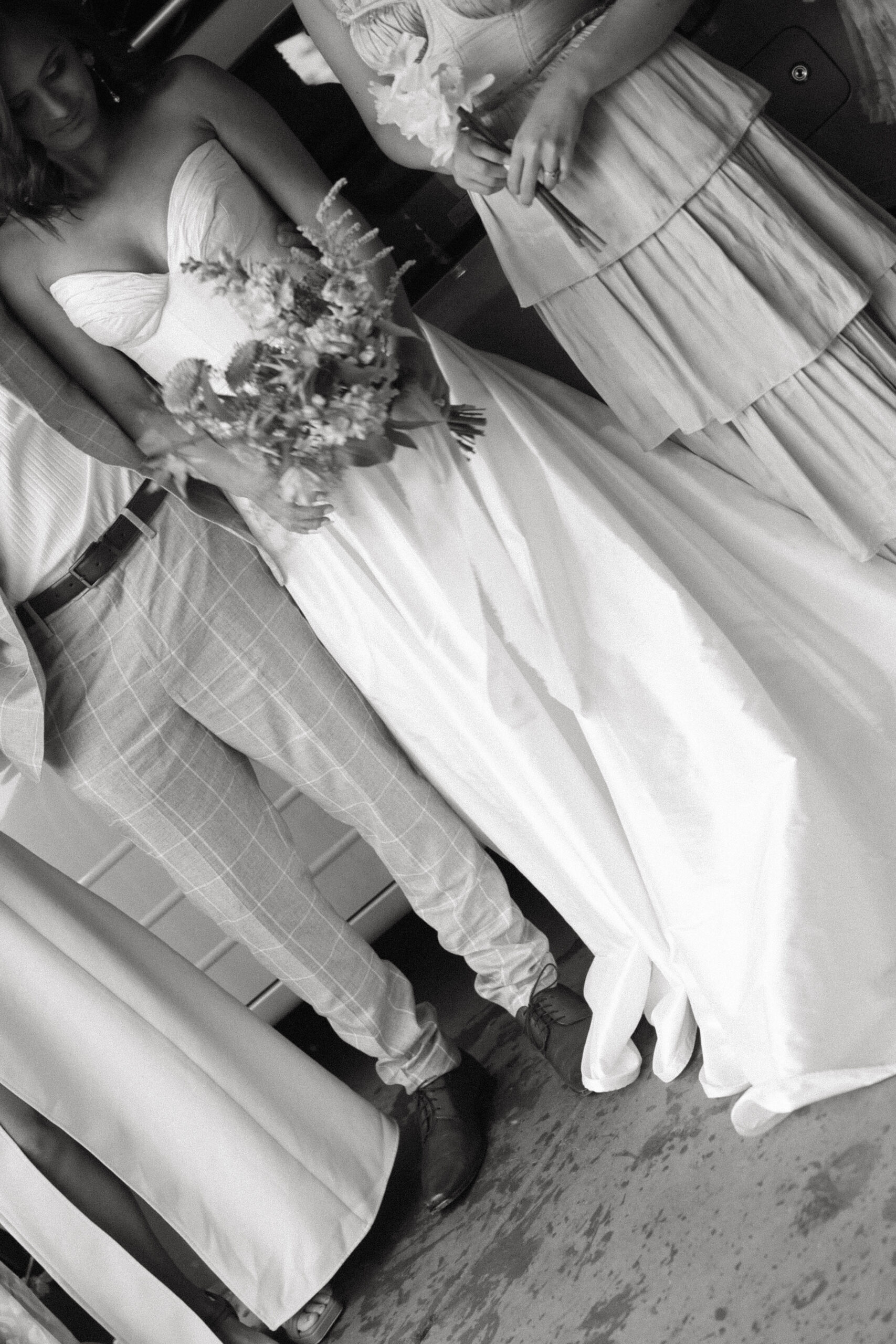 bride's dress and florals close up 