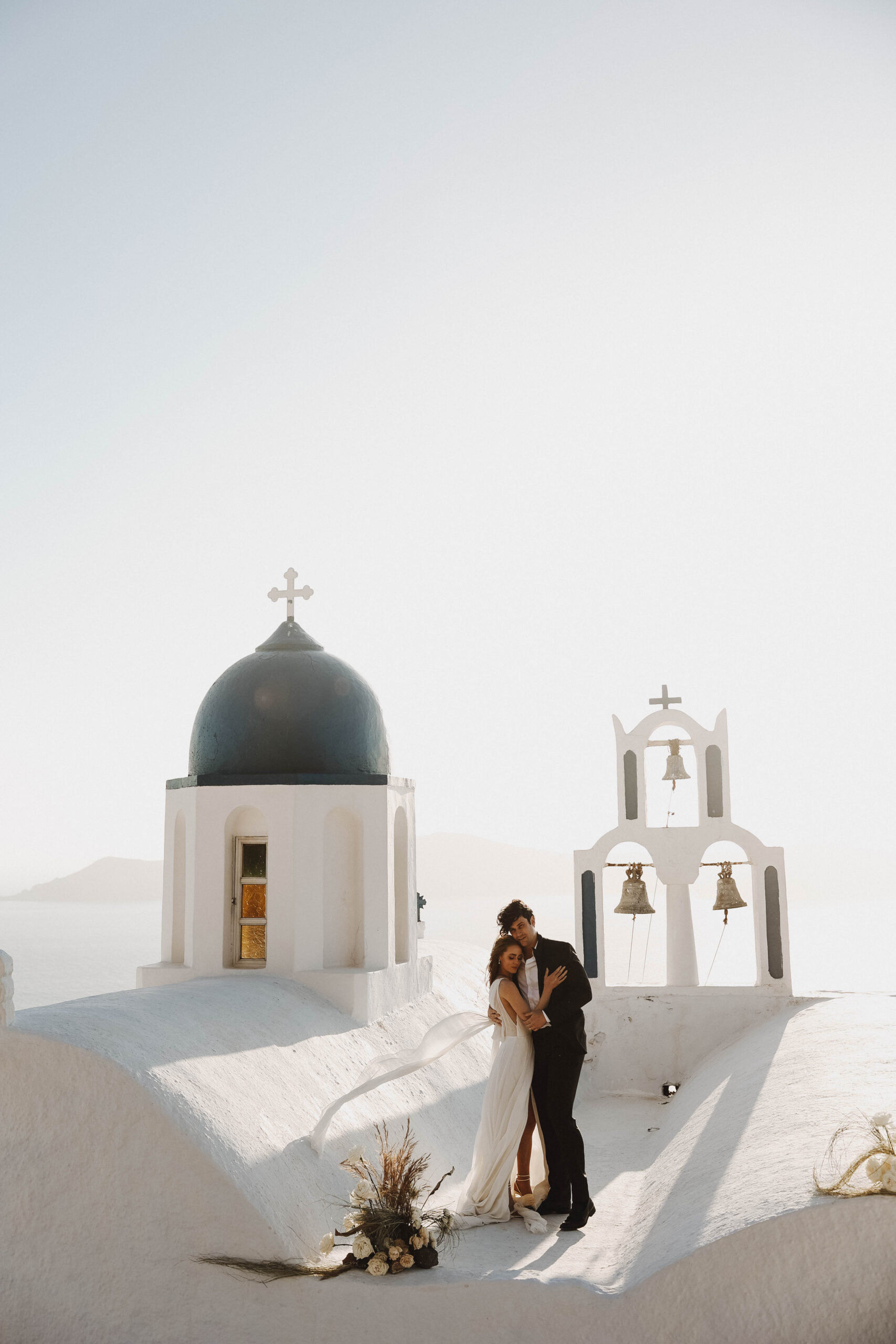 newly weds on a roof in greece during their Santorini Greece elopement