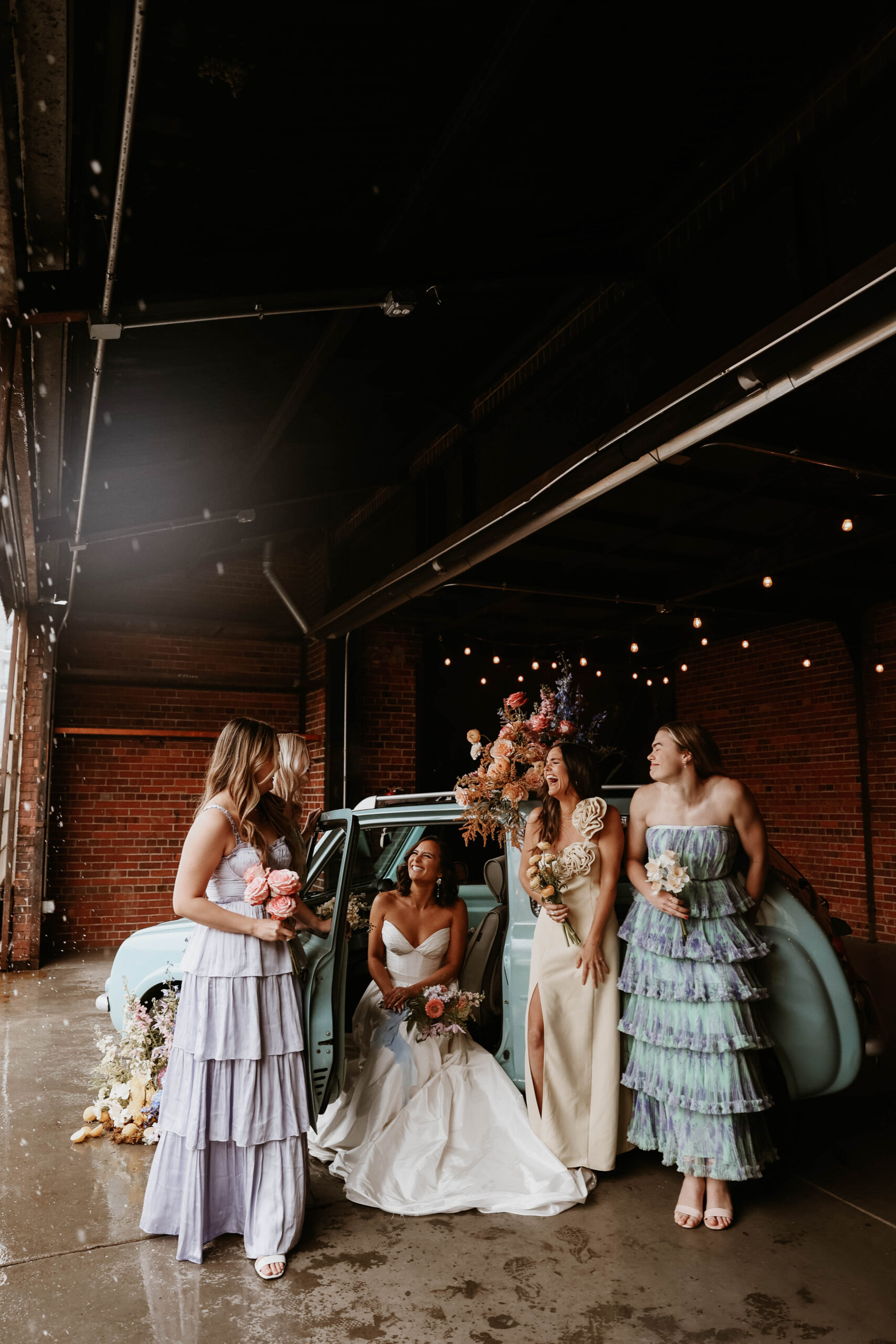 bridesmaids wearing mis matched dresses for a garden wedding