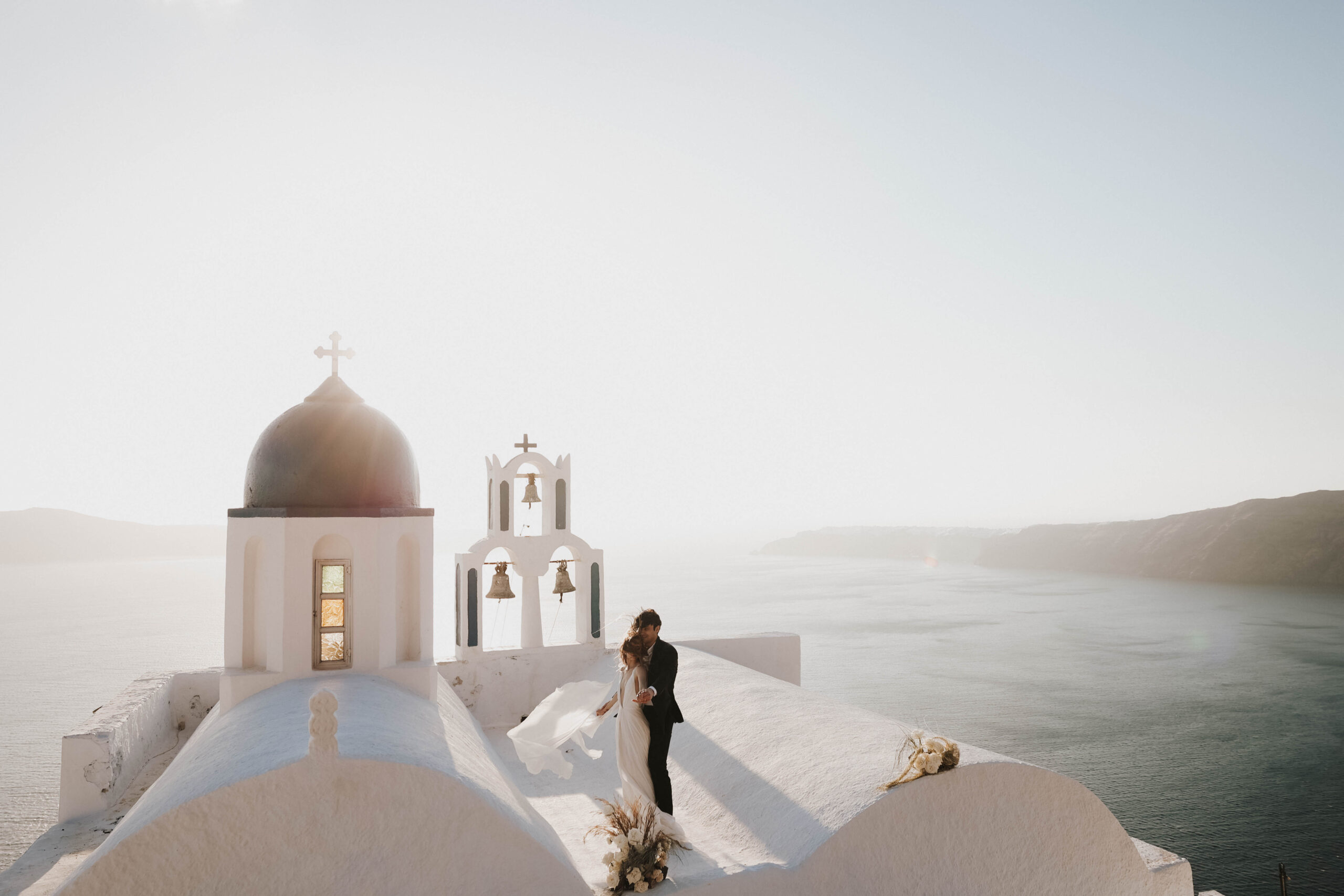 bride and groom on the roof of the villa during their Santorini Greece elopement