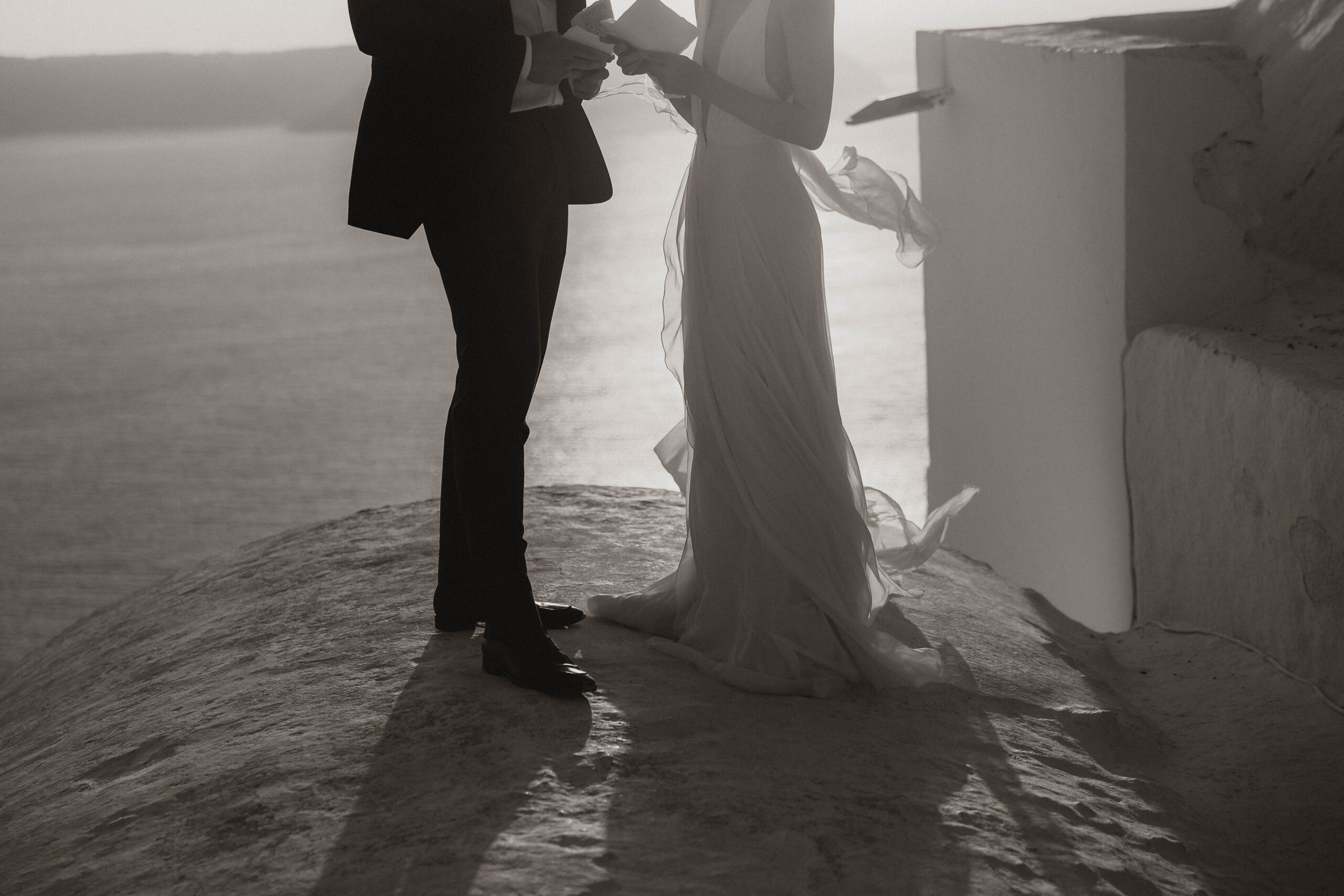 bride and groom reading their vows during Santorini Greece elopement