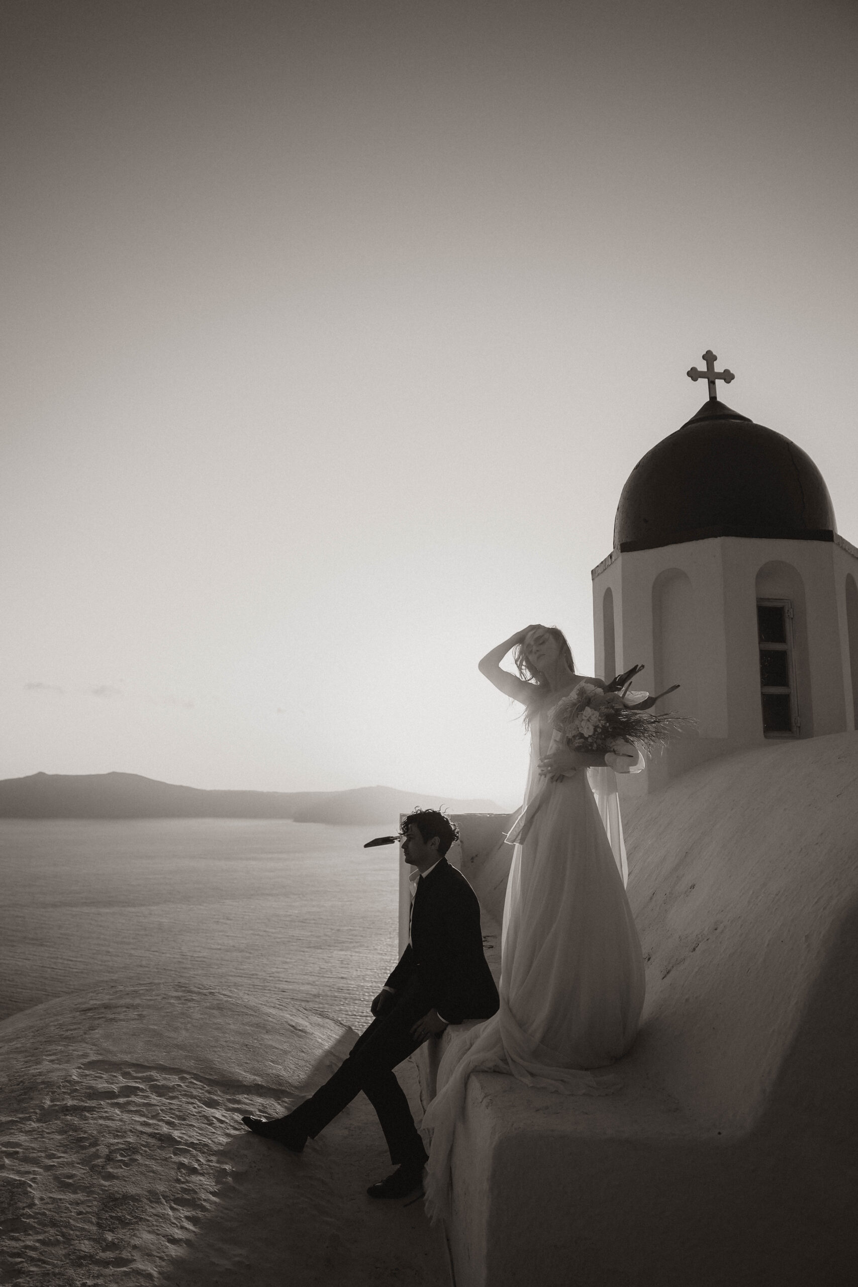 bride and groom on the villa roof for Santorini Greece elopement portraits