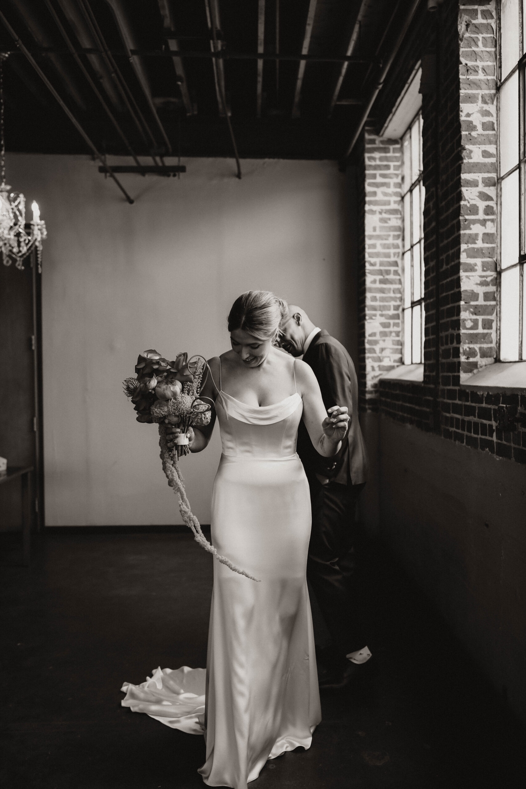 groom checking out bride after first look at one of the most perfect Denver Colorado venues