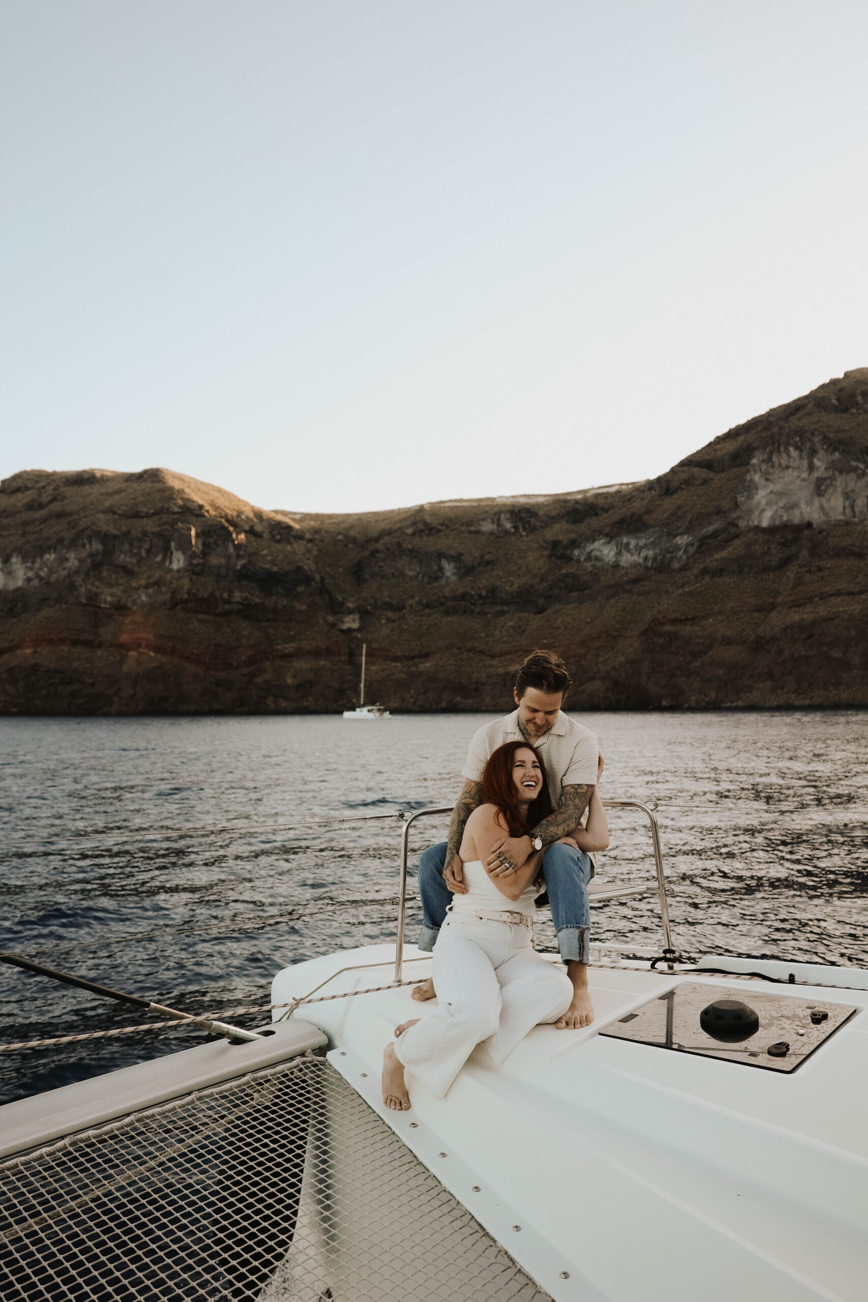 a couple laughing together in Greece during their couples session