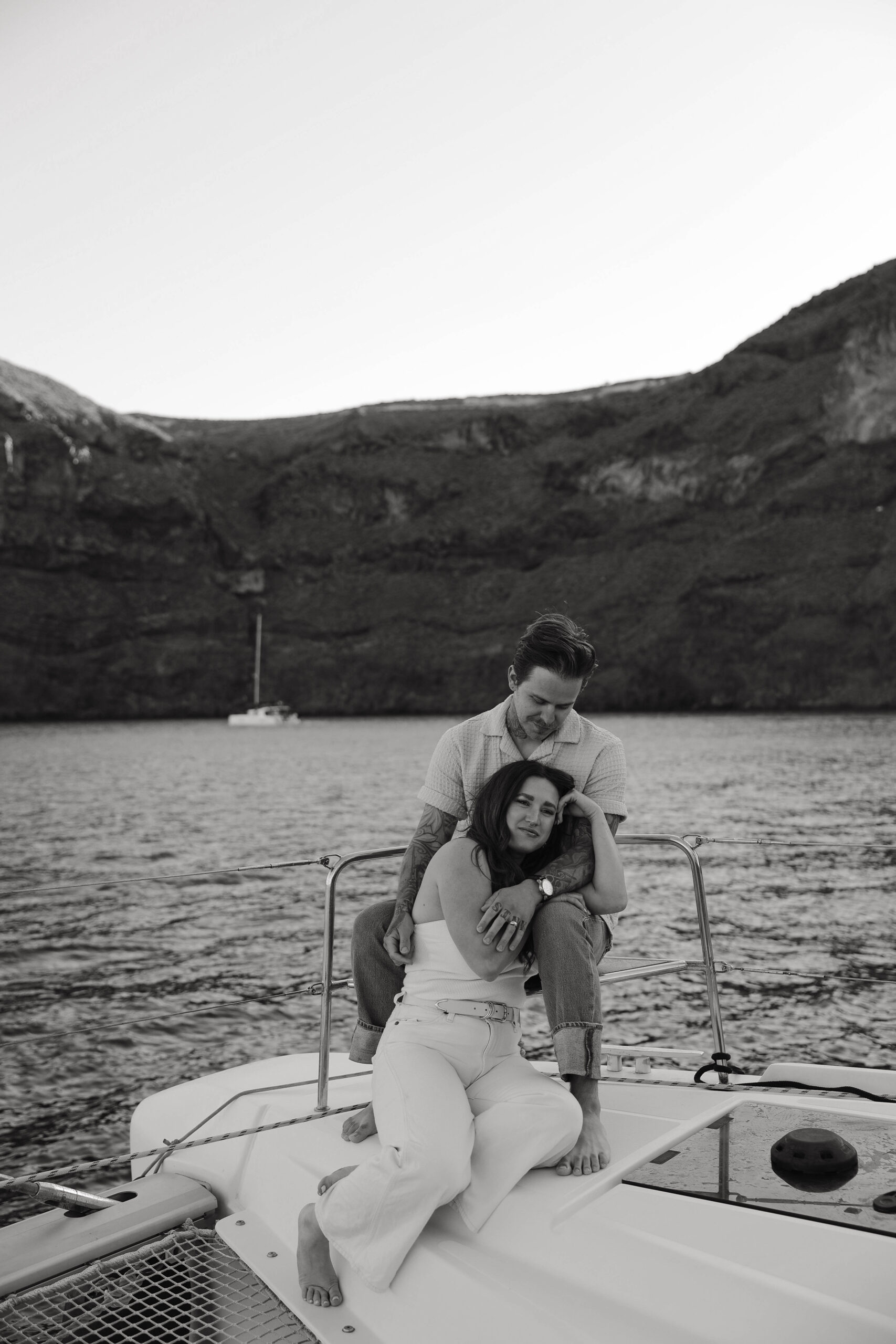 a couple sitting on a boat during their couples session