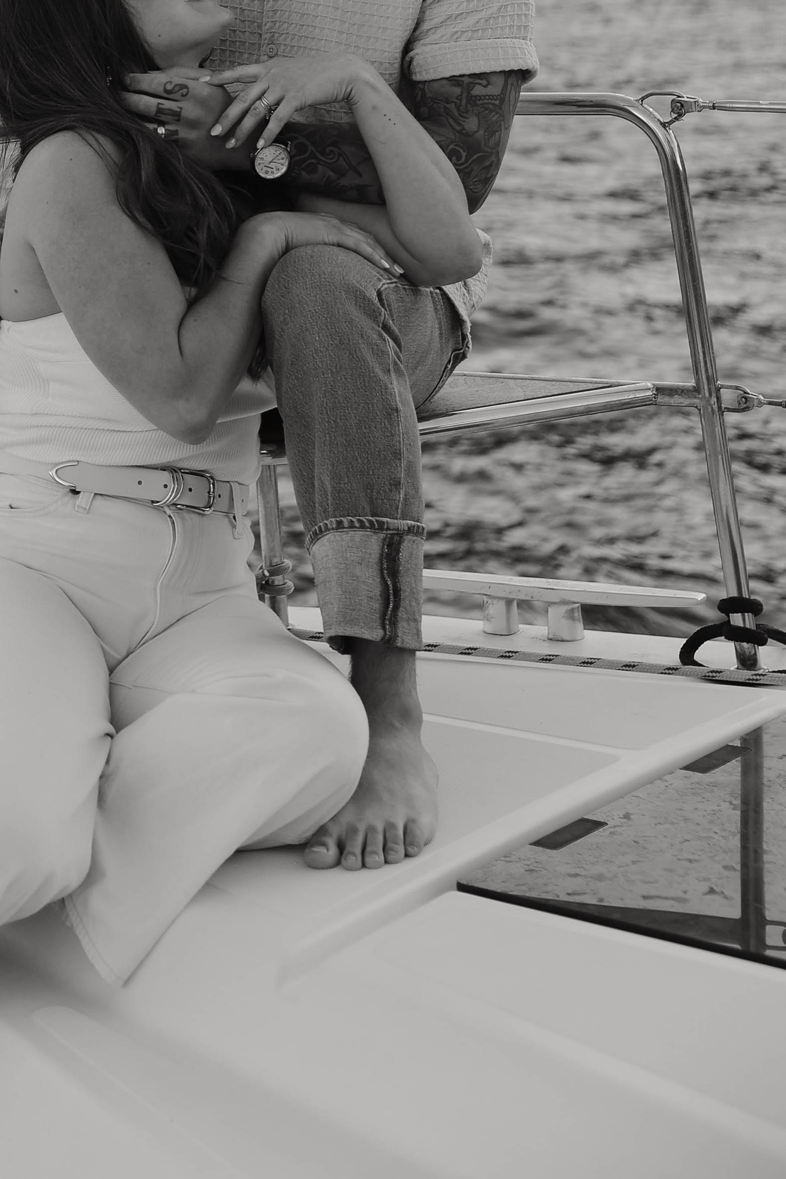 close up of a couples hand as he holds her face during their couples session