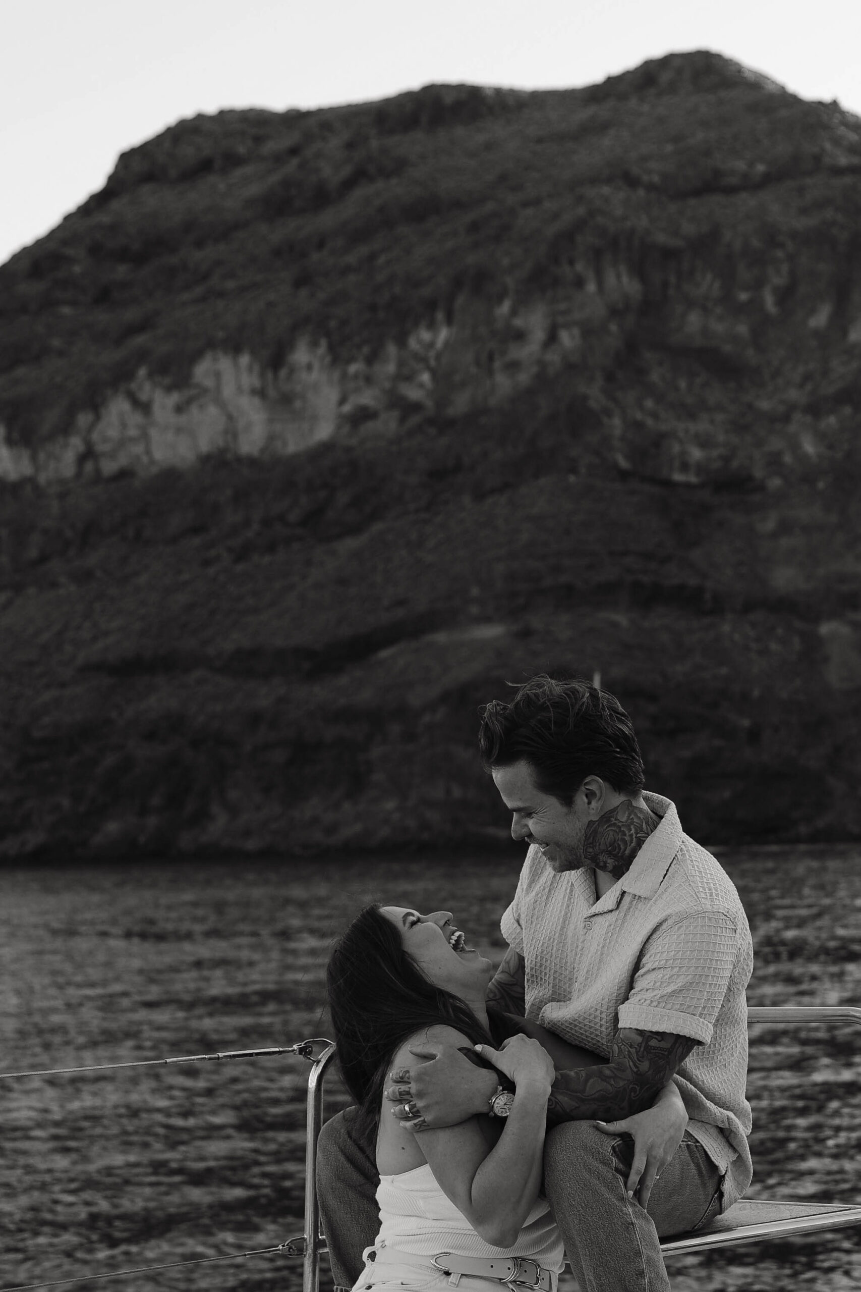 a couple laughing together during their boat couples session