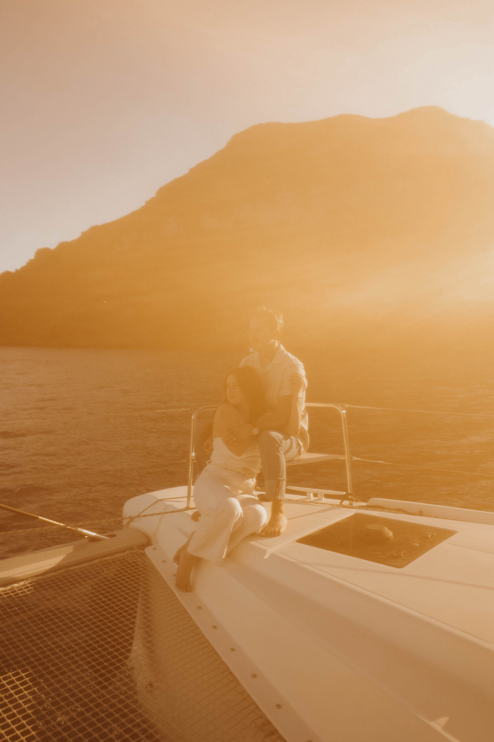 a vintage looking photo of a couple on a boat in Greece 