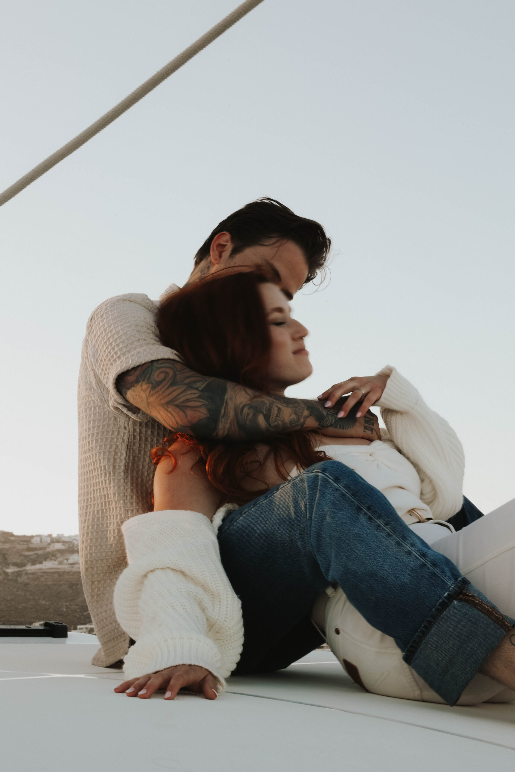 a man holding a woman during their couples session