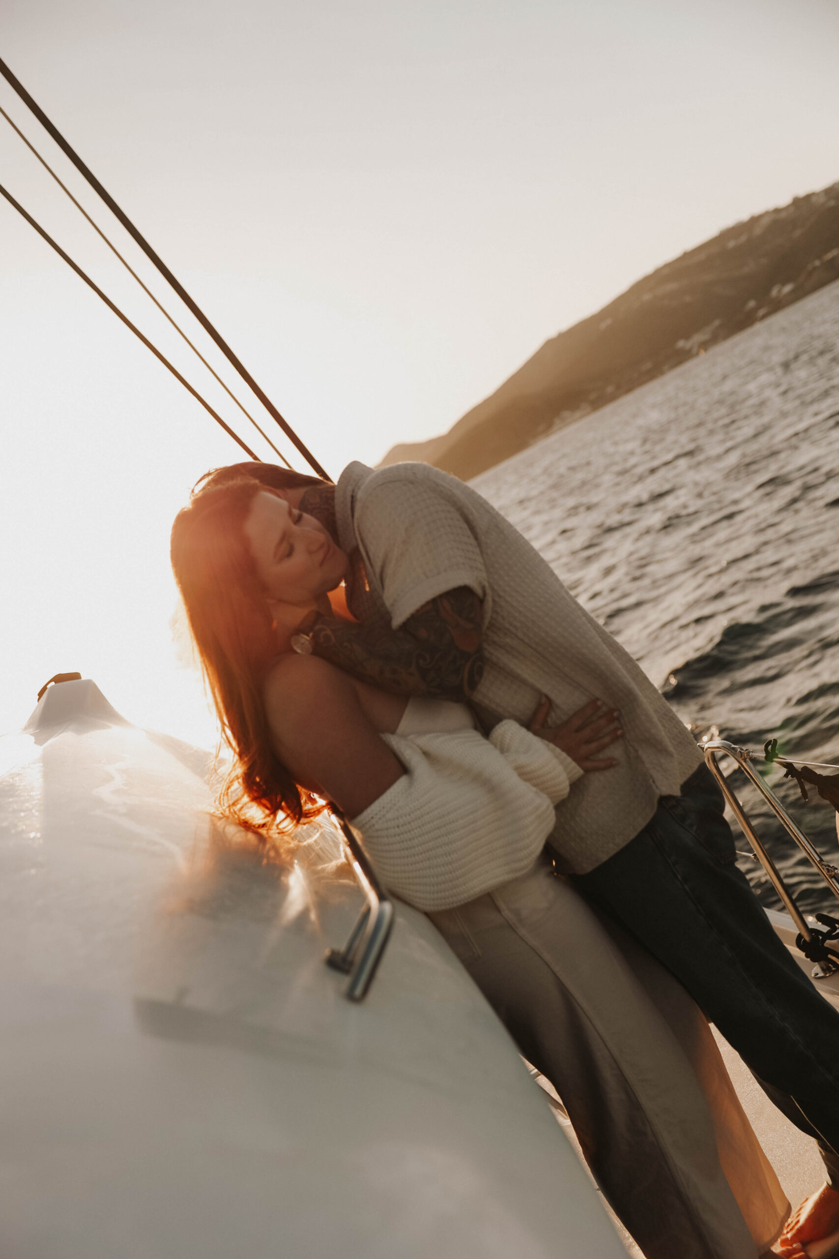 a woman kissing on a woman during their couples session