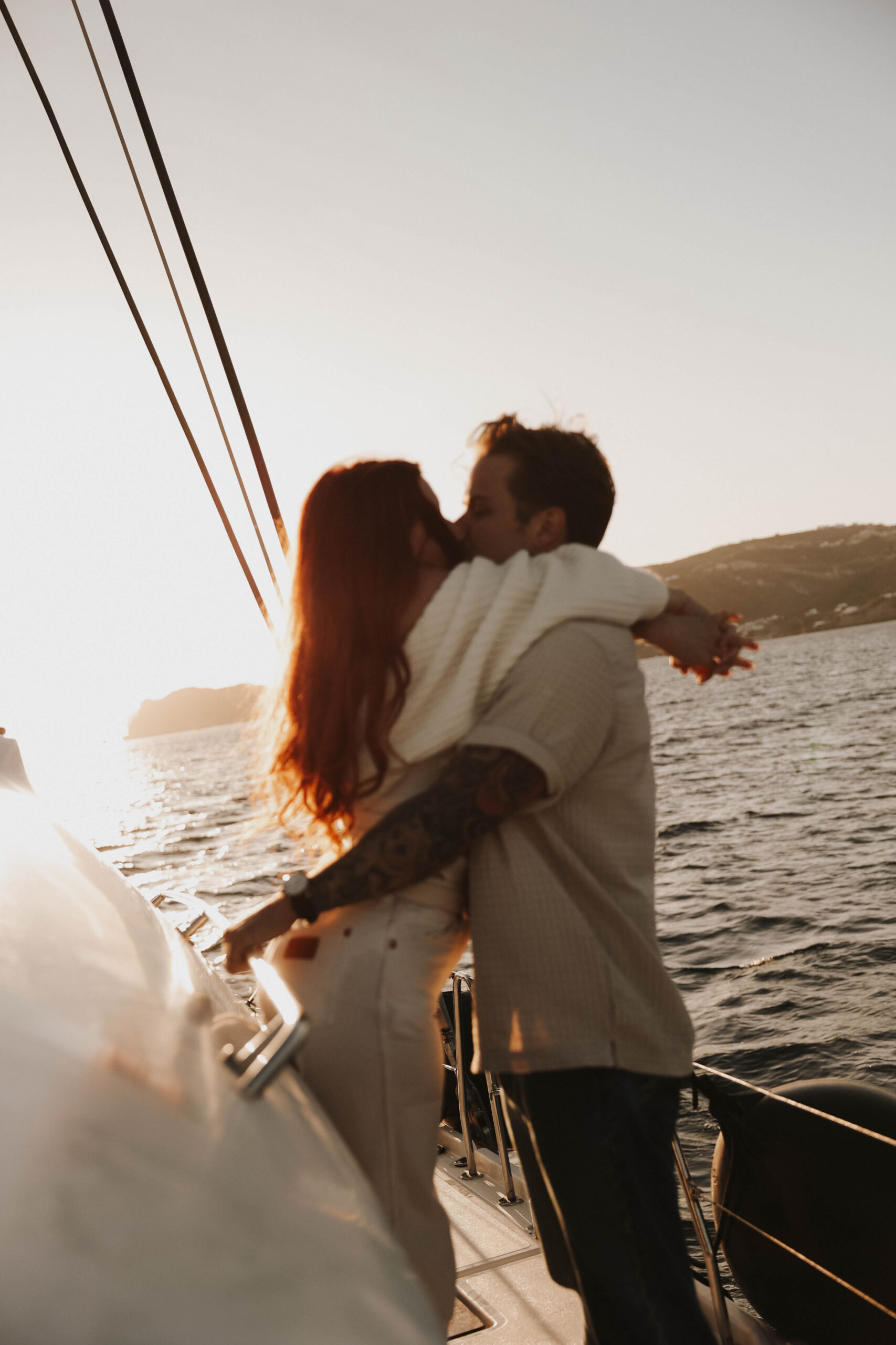 a couple kissing on a boat during their couples session