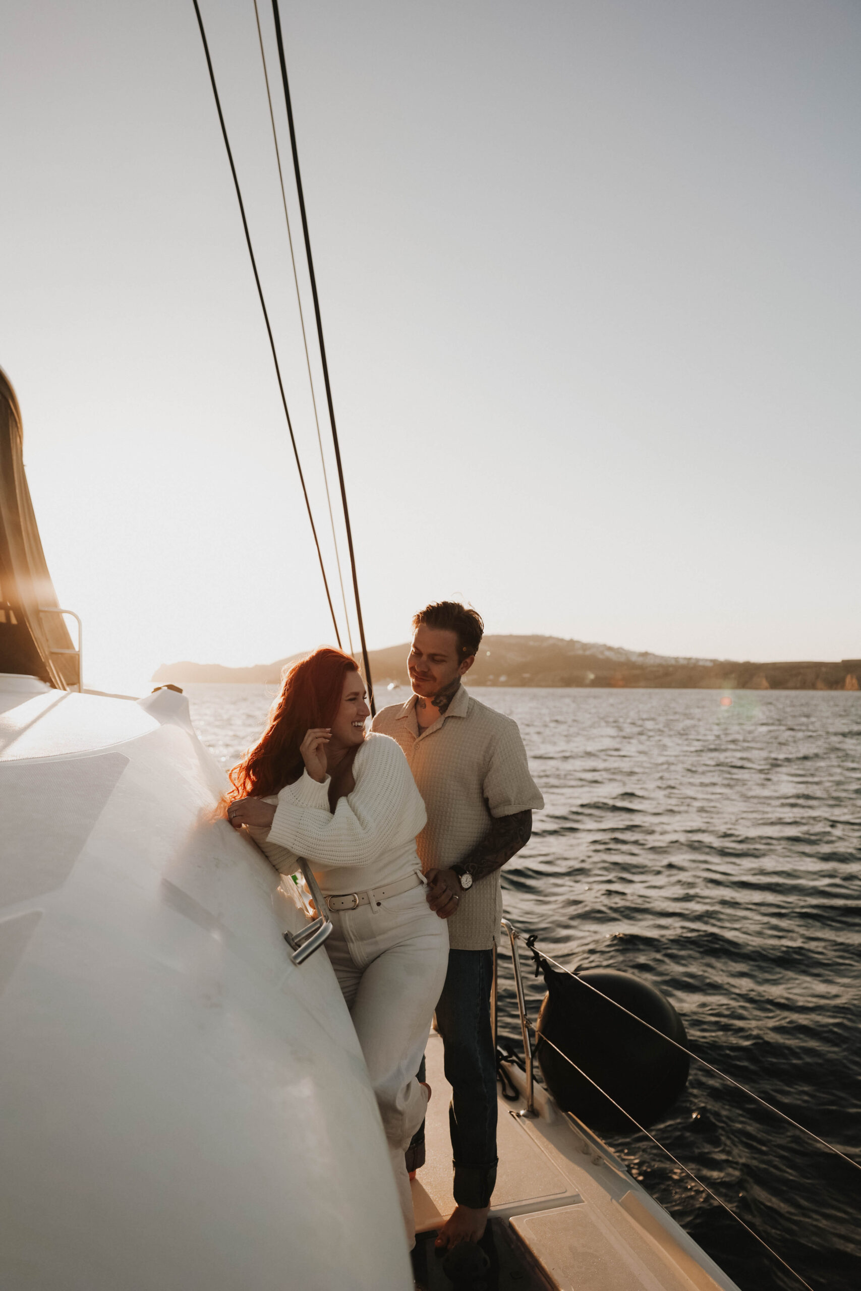 a couple standing together on a boat during their couples session