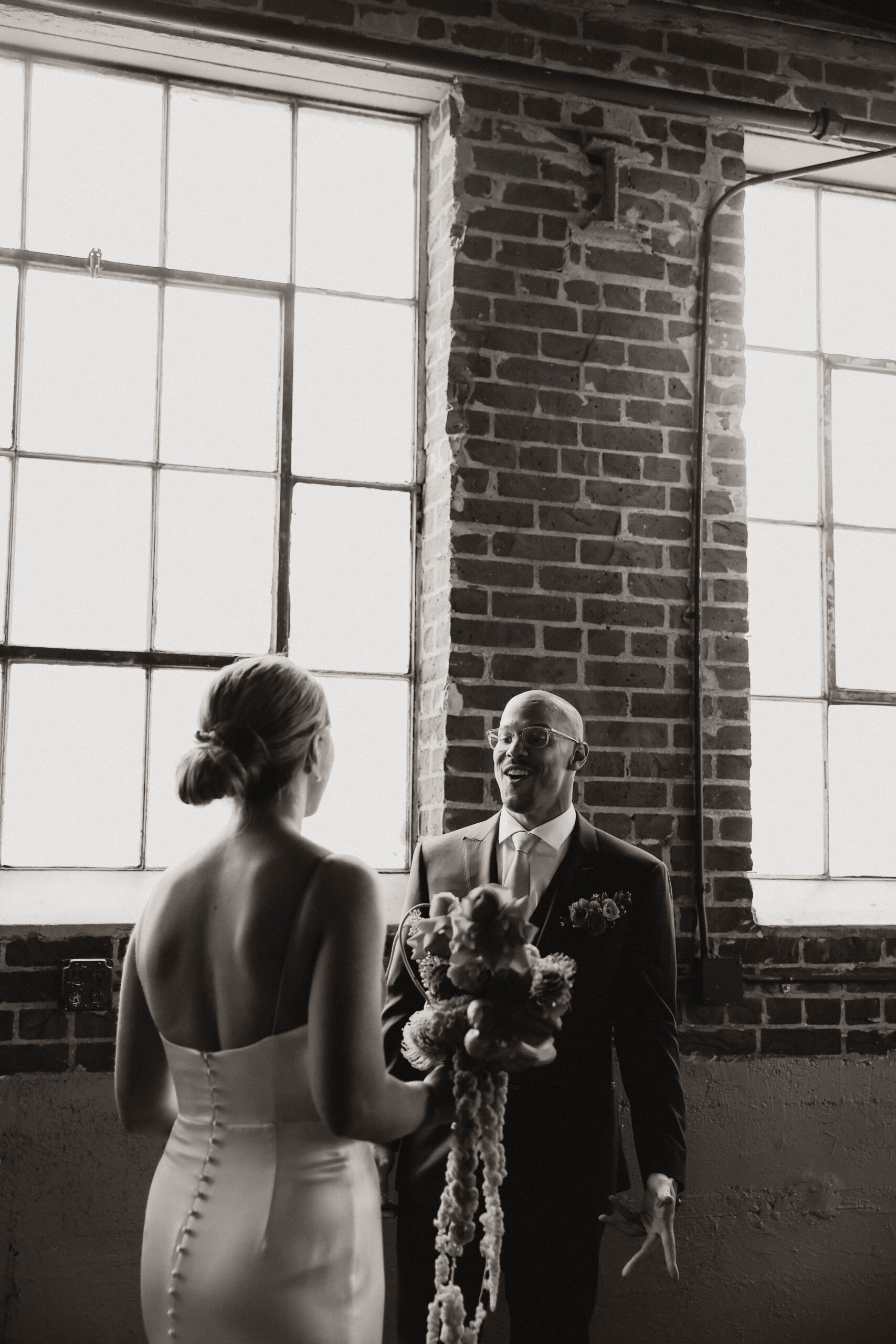 groom's expression as he sees his bride 