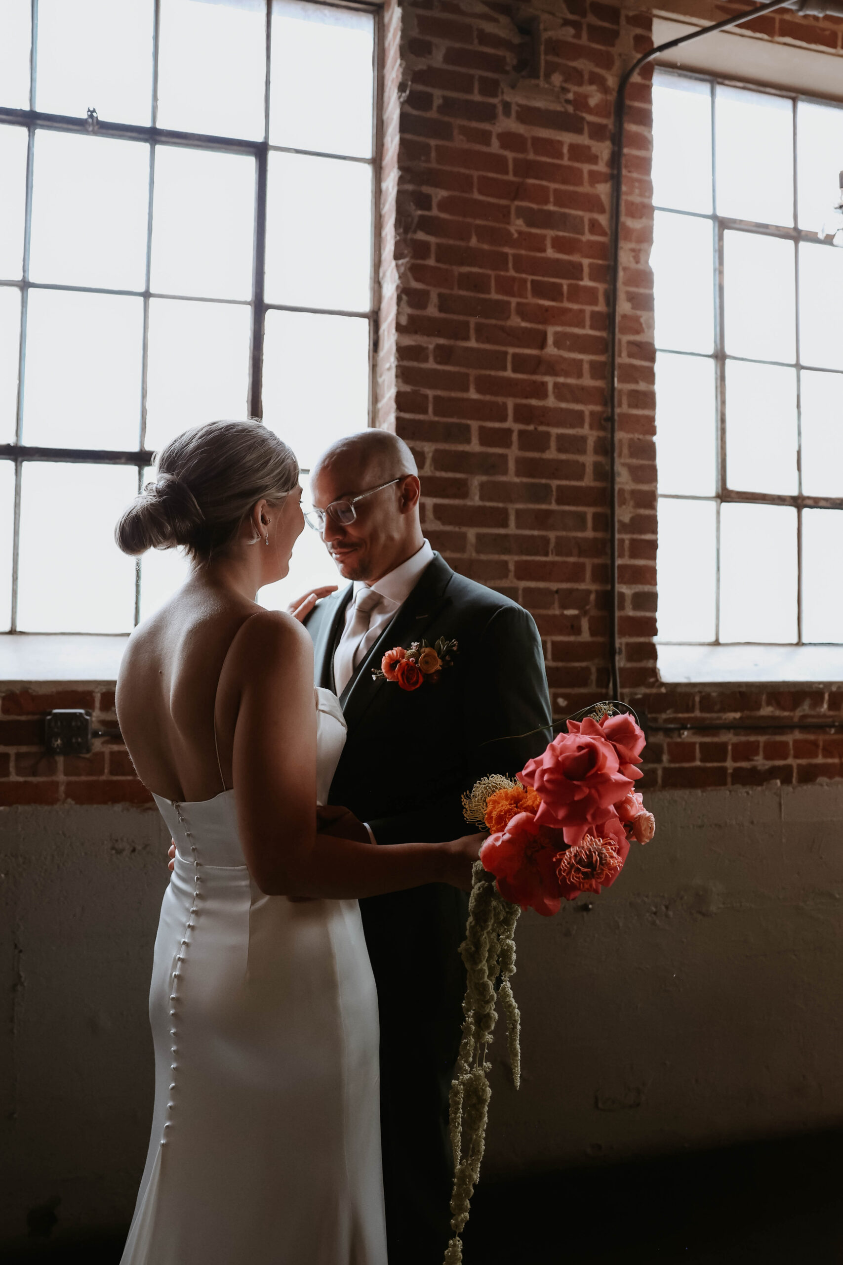 groom hugging bride after first look 