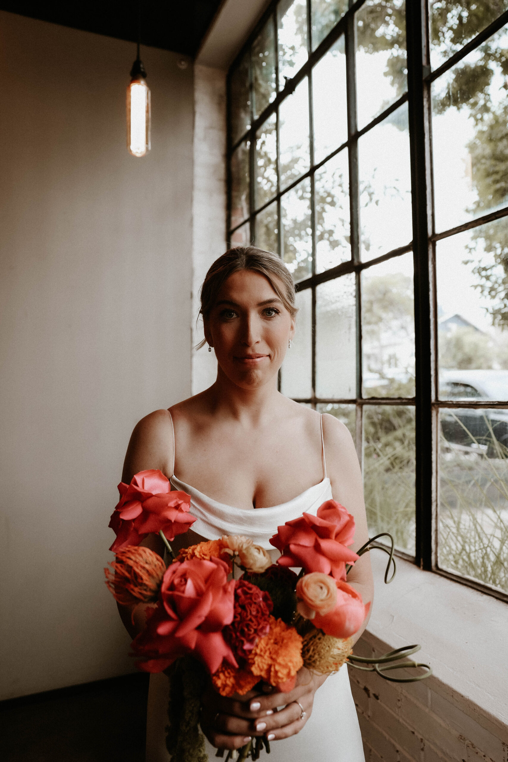 bridal portrait by a big window at one of the most perfect Denver Colorado venues