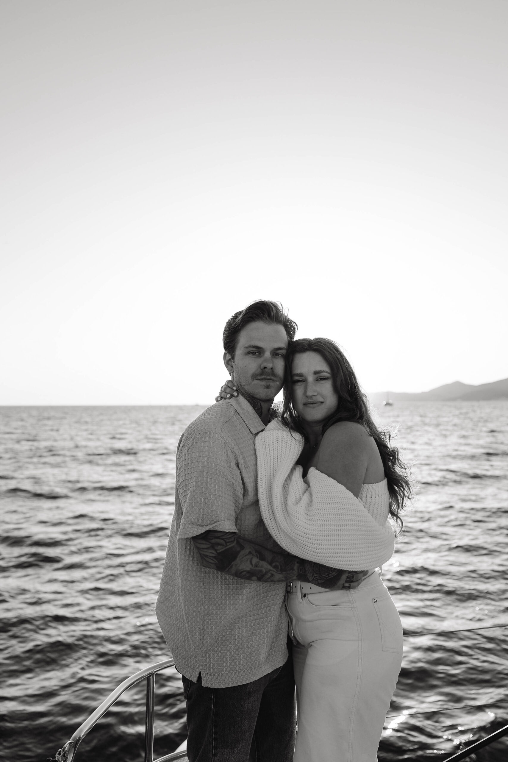 a couple holding each other and looking at the camera during their couples session